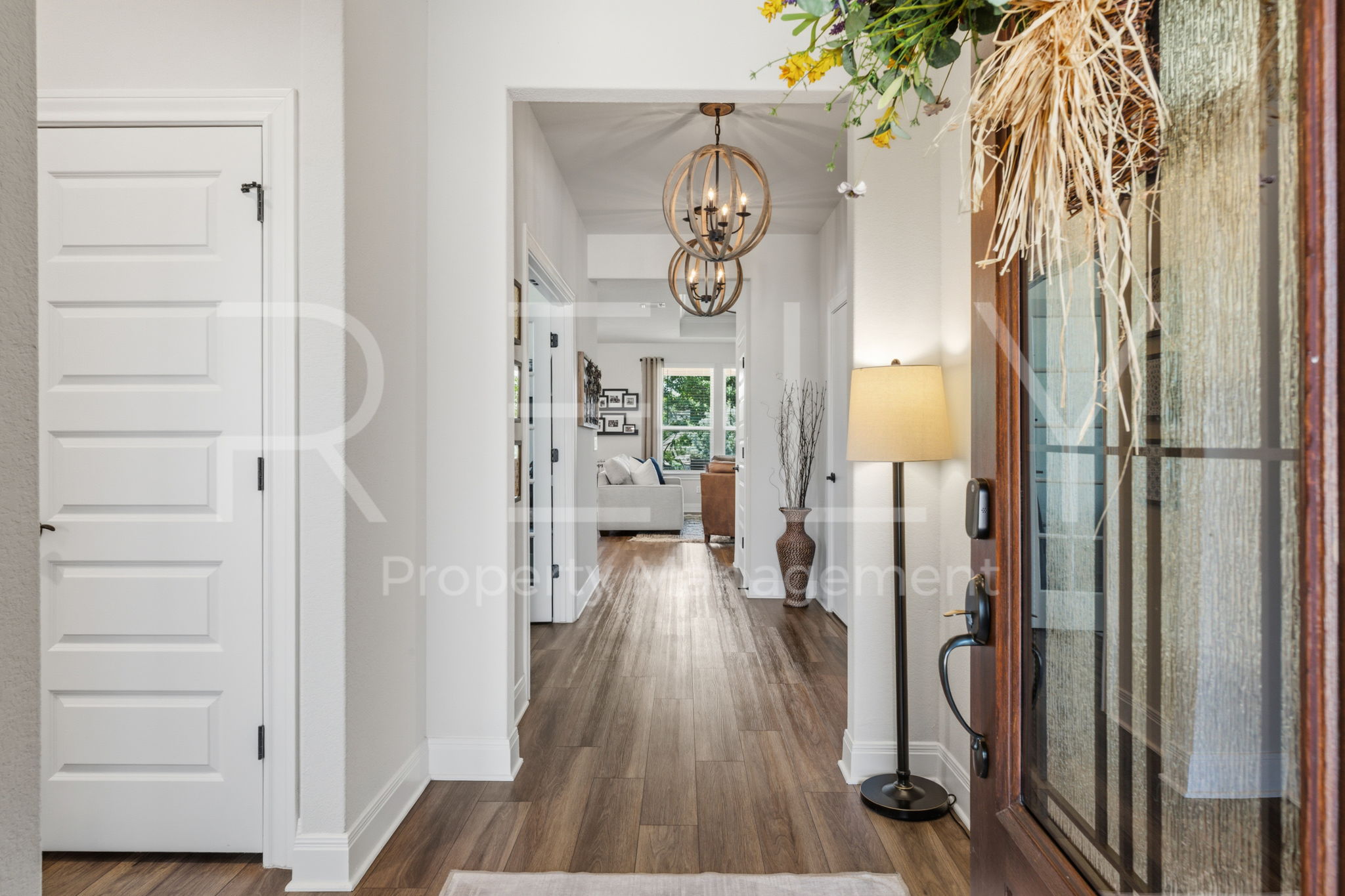 101 Spanish Star Street Georgetown, TX 78633 - Photo 5 of 39 An inviting entry foyer boasts warm wood flooring, leading into the heart of the home.