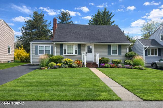 68 Davis Lane Red Bank, NJ 07701 - Photo 1 of 41 a front view of a house with a garden