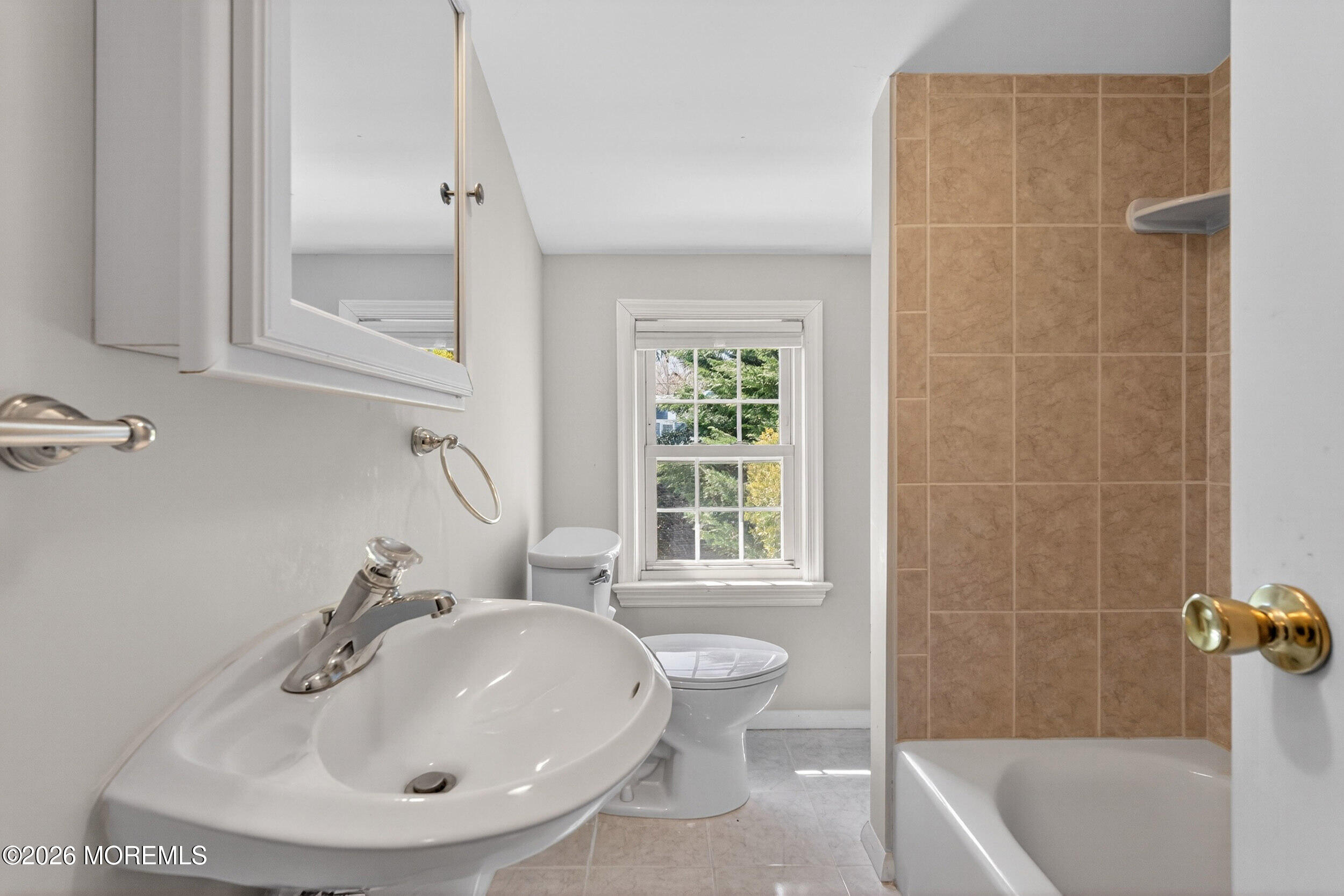68 Davis Lane Red Bank, NJ 07701 - Photo 15 of 41 a bathroom with a sink a toilet and tub