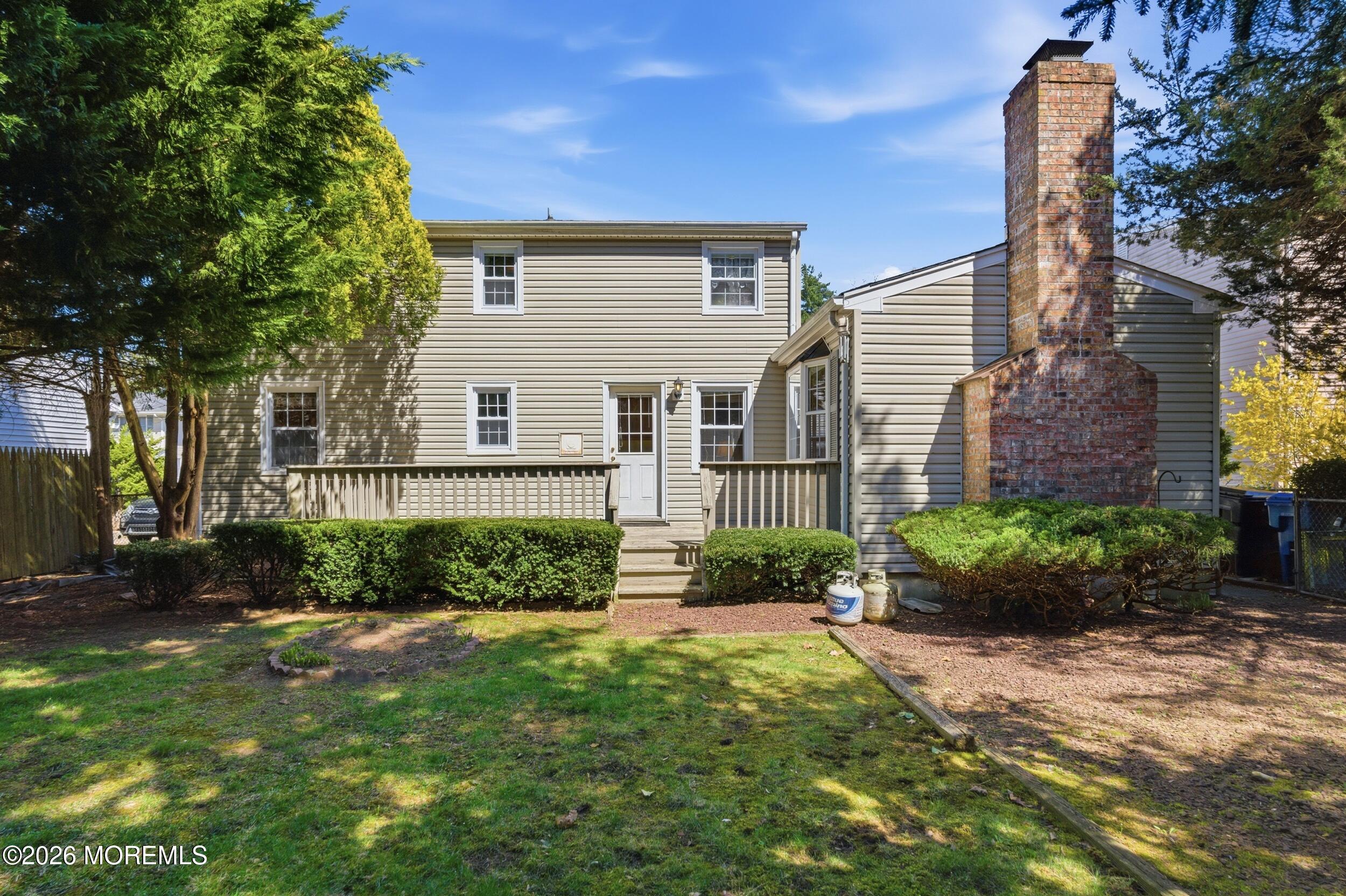 68 Davis Lane Red Bank, NJ 07701 - Photo 27 of 41 a front view of a house with garden