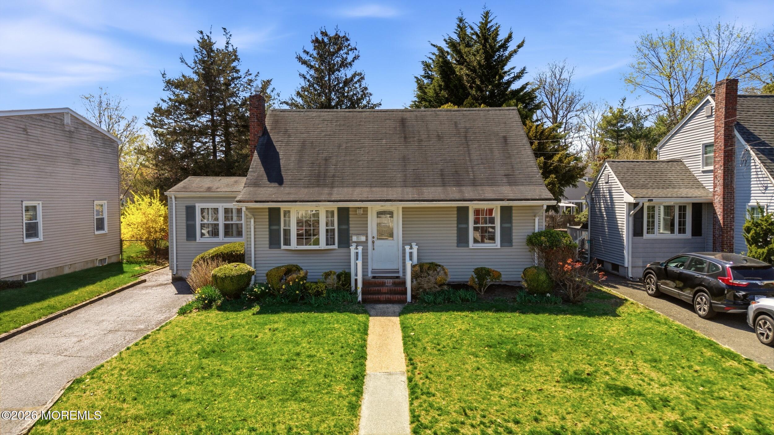 68 Davis Lane Red Bank, NJ 07701 - Photo 3 of 41 front view of a house with a yard