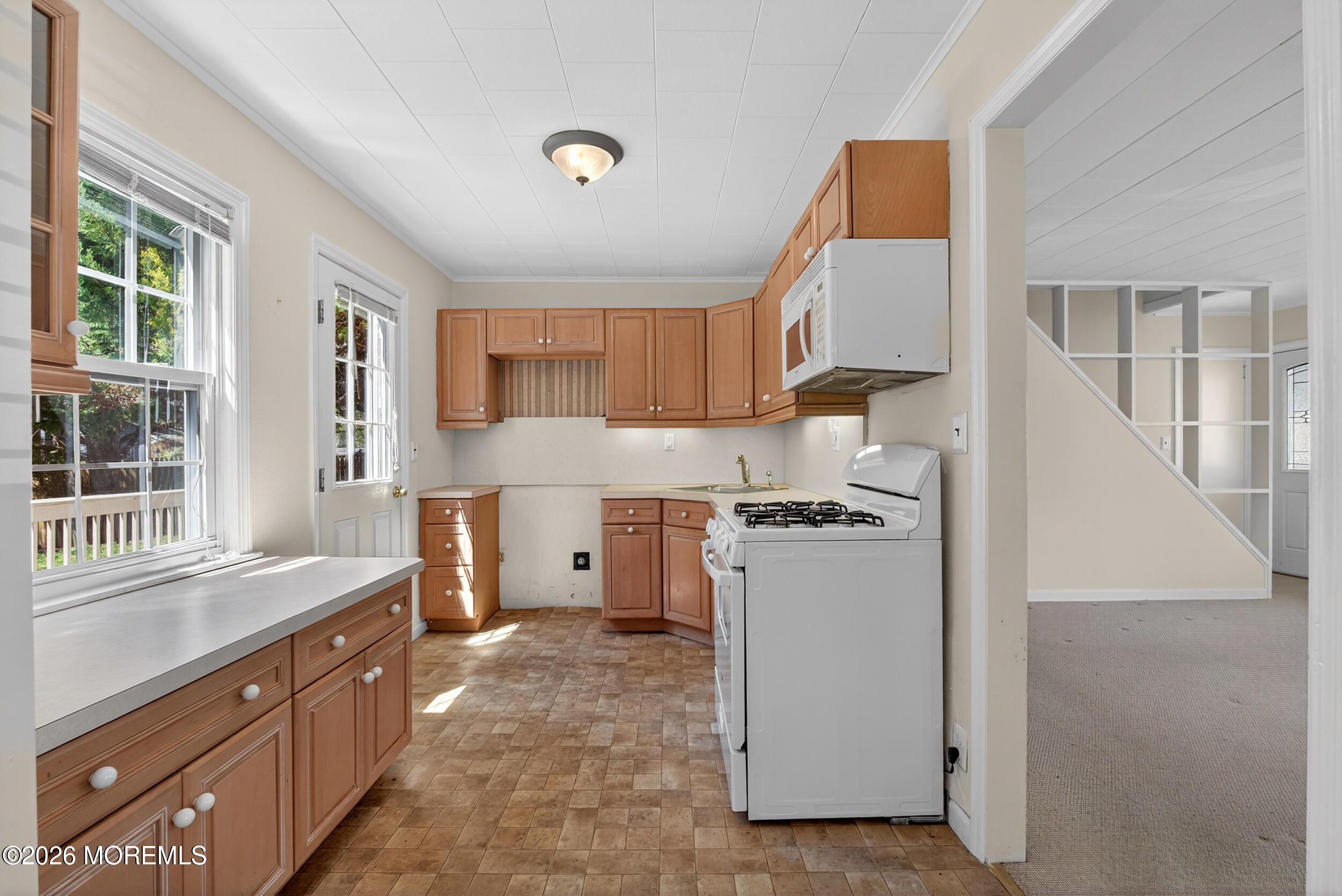 68 Davis Lane Red Bank, NJ 07701 - Photo 4 of 41 a kitchen with stainless steel appliances granite countertop a stove a sink and a refrigerator