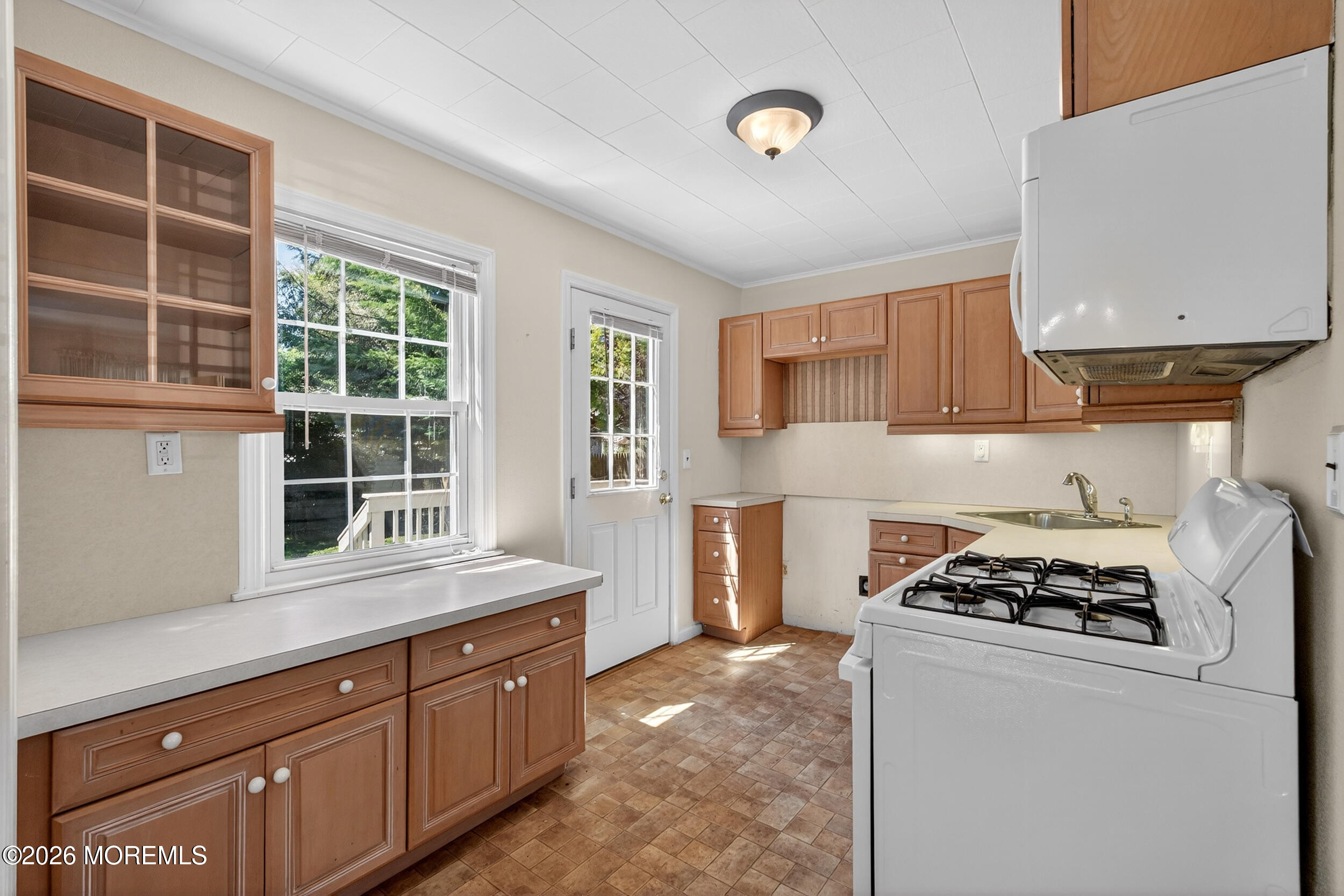 68 Davis Lane Red Bank, NJ 07701 - Photo 5 of 41 a kitchen with stainless steel appliances a sink a stove and a refrigerator