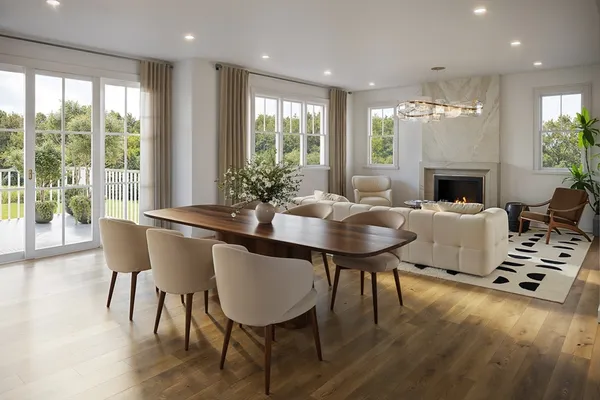 a living room with furniture a fireplace and a floor to ceiling window