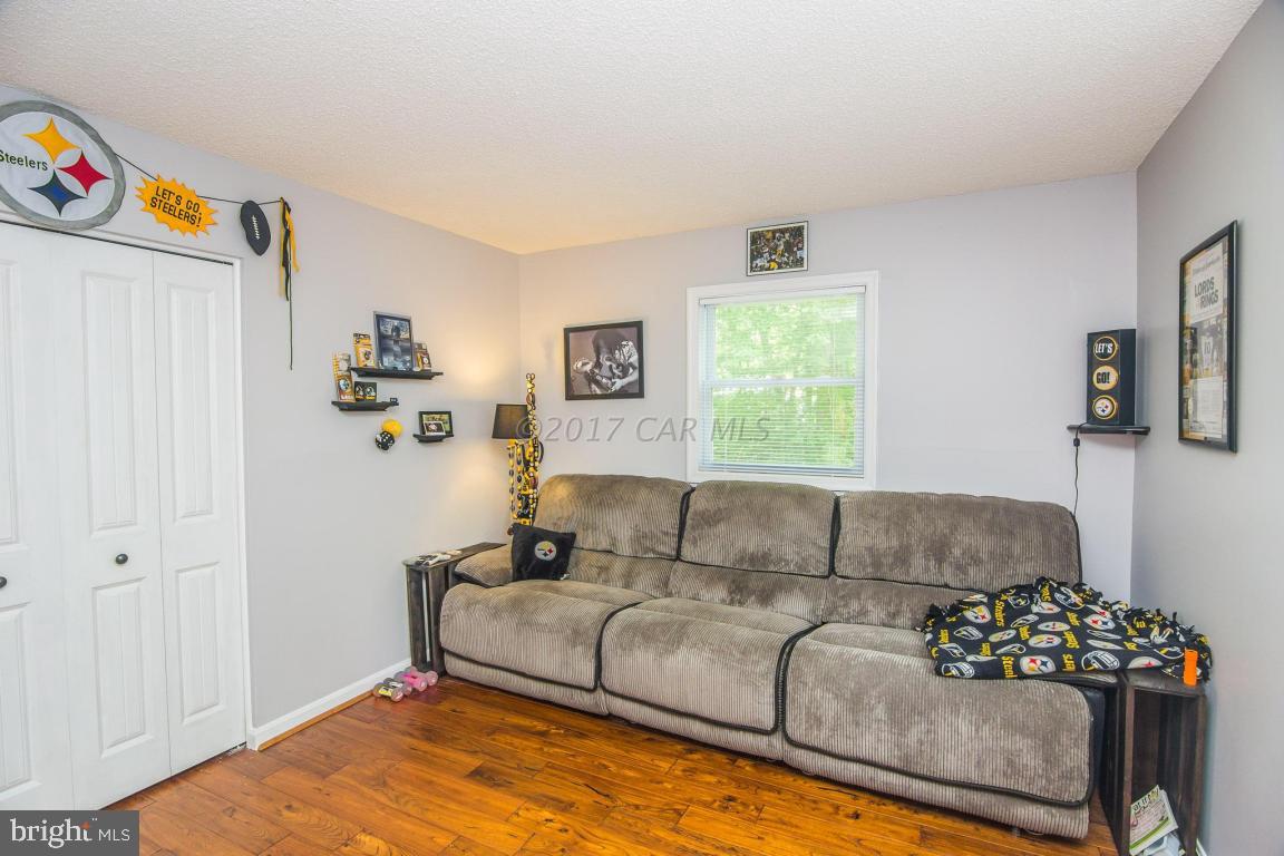 56 Pinehurst Road Ocean Pines, MD 21811 - Photo 36 of 42 a living room with furniture and a window