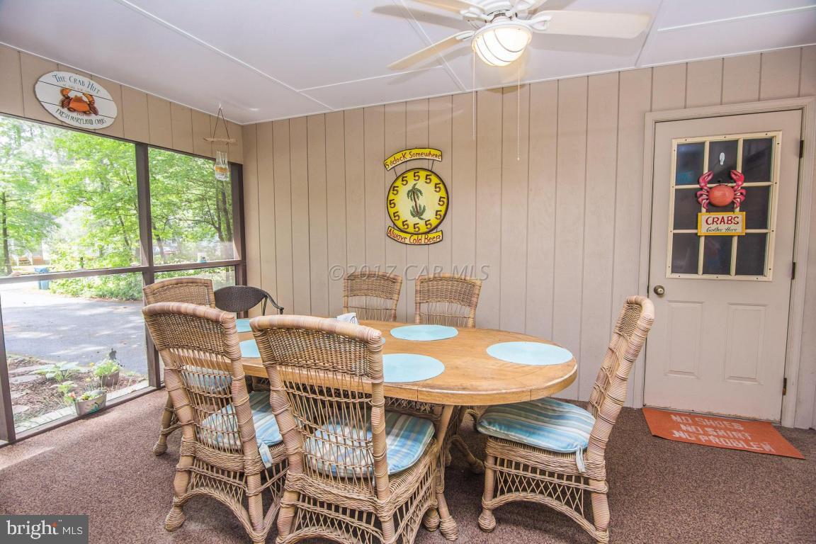 56 Pinehurst Road Ocean Pines, MD 21811 - Photo 40 of 42 a view of a dining room with furniture window and outside view