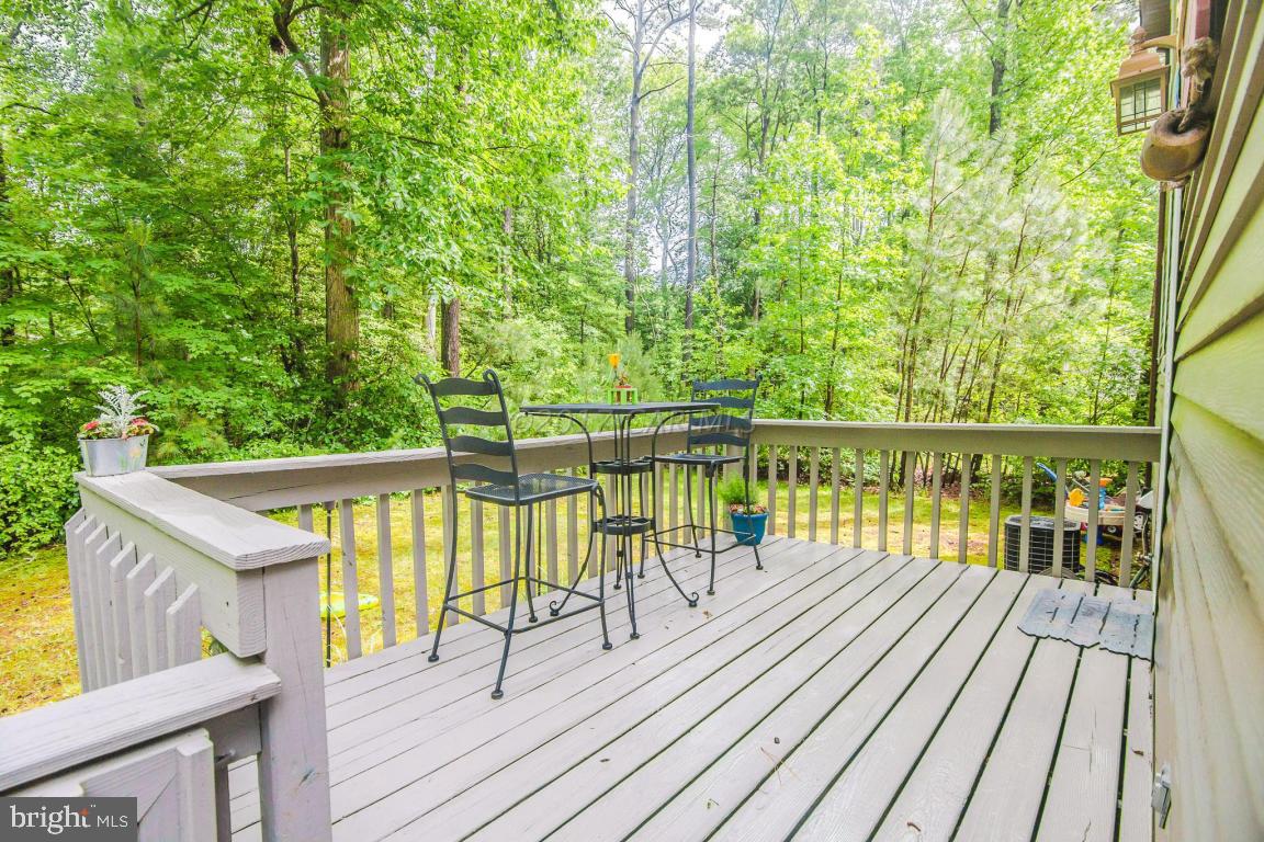 56 Pinehurst Road Ocean Pines, MD 21811 - Photo 8 of 42 a view of balcony with wooden floor and fence
