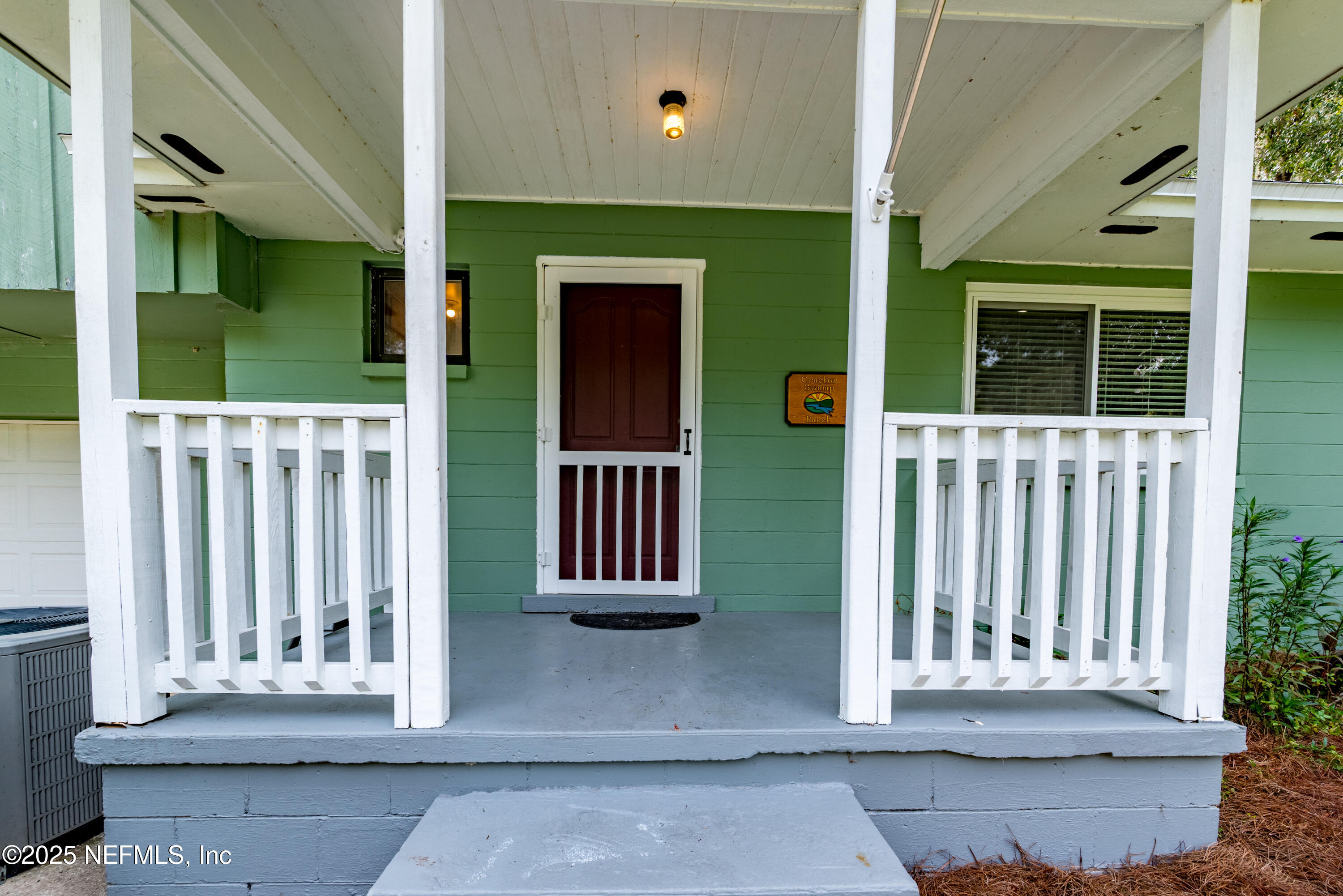 18311 Northeast 21 Street Gainesville, FL 32609 - Photo 12 of 80 a view of a house with a small yard