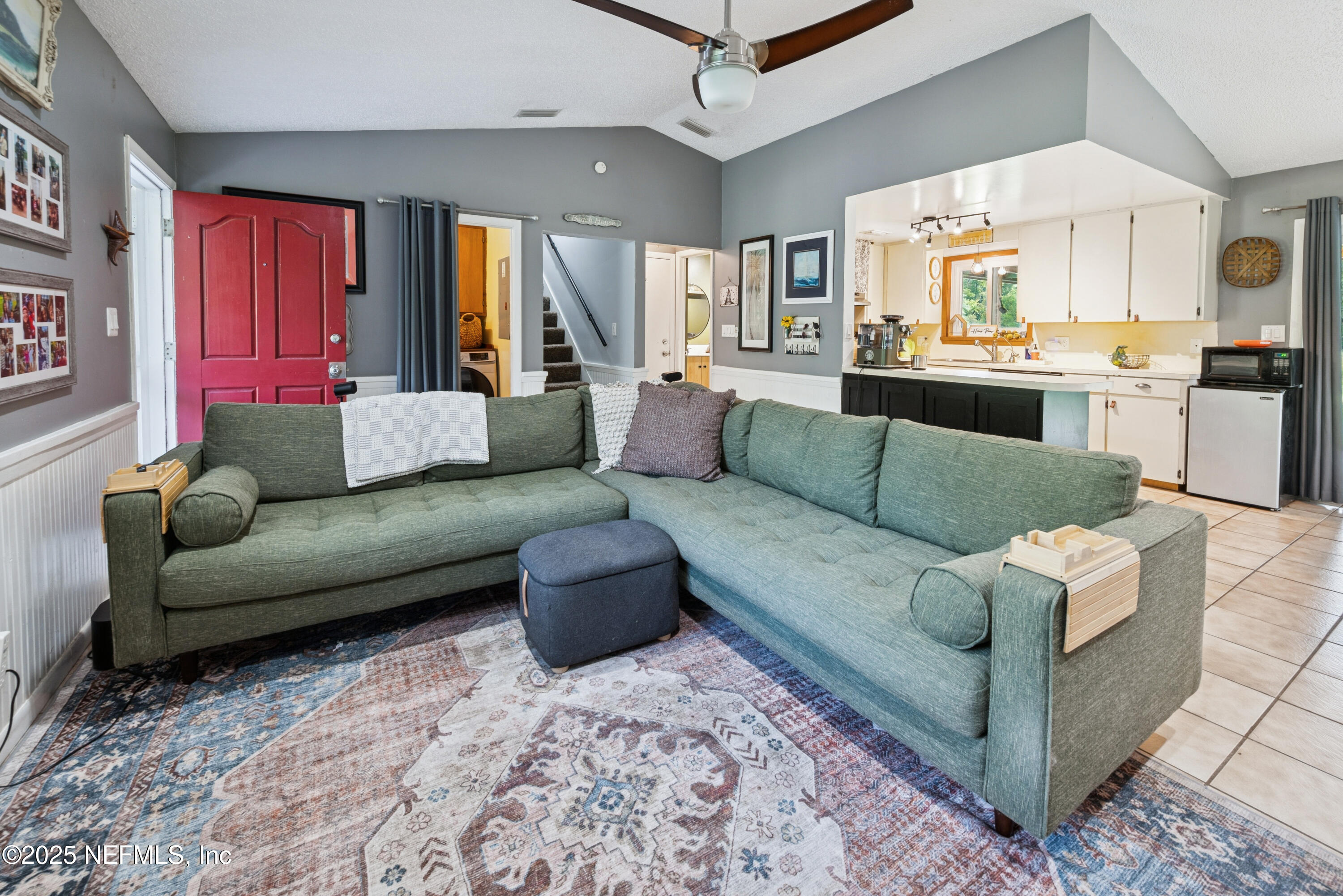 18311 Northeast 21 Street Gainesville, FL 32609 - Photo 16 of 80 a living room with furniture and a large window