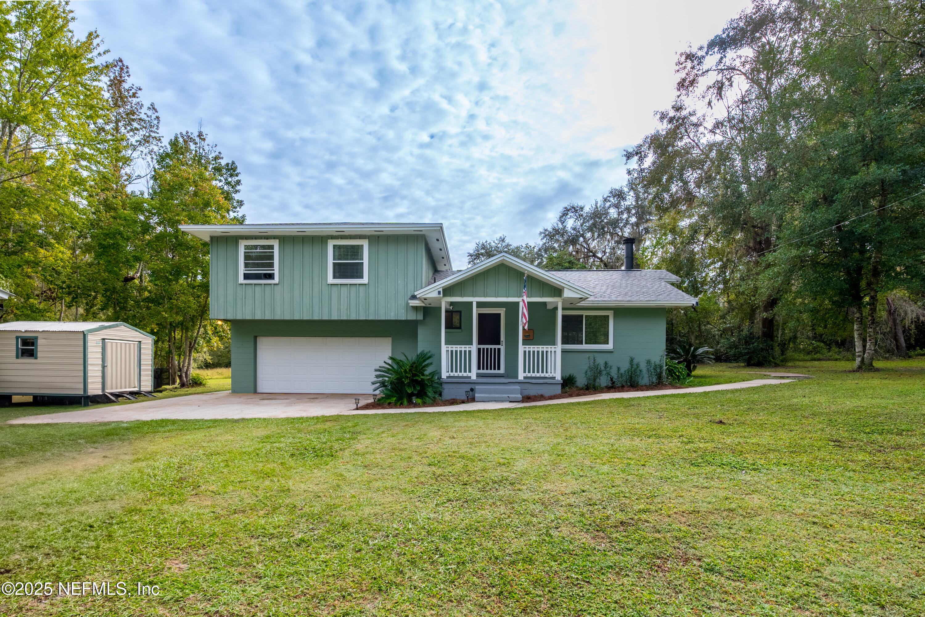 18311 Northeast 21 Street Gainesville, FL 32609 - Photo 2 of 80 a front view of a house with a garden