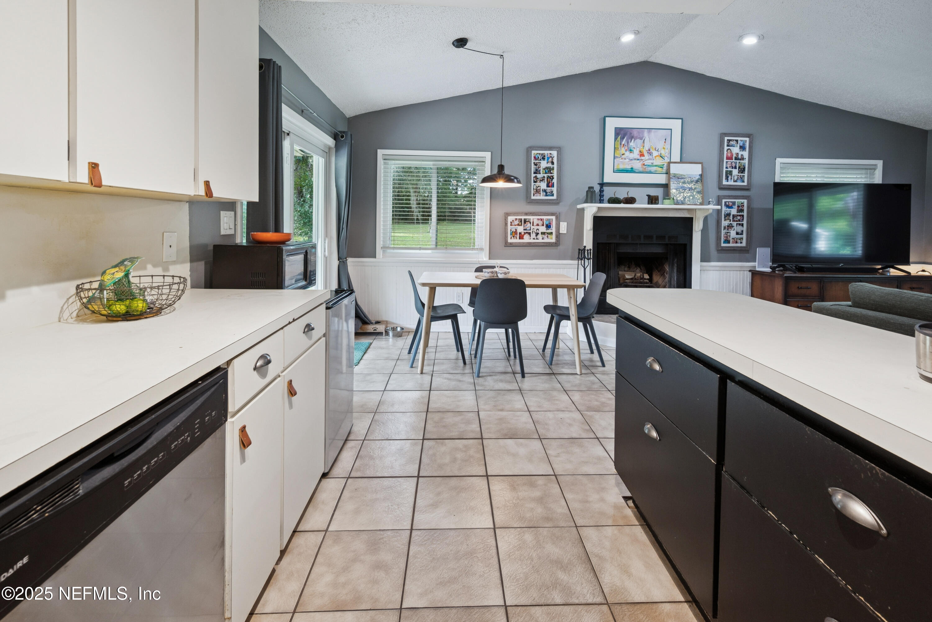 18311 Northeast 21 Street Gainesville, FL 32609 - Photo 27 of 80 a open kitchen with stainless steel appliances a stove a sink and a microwave