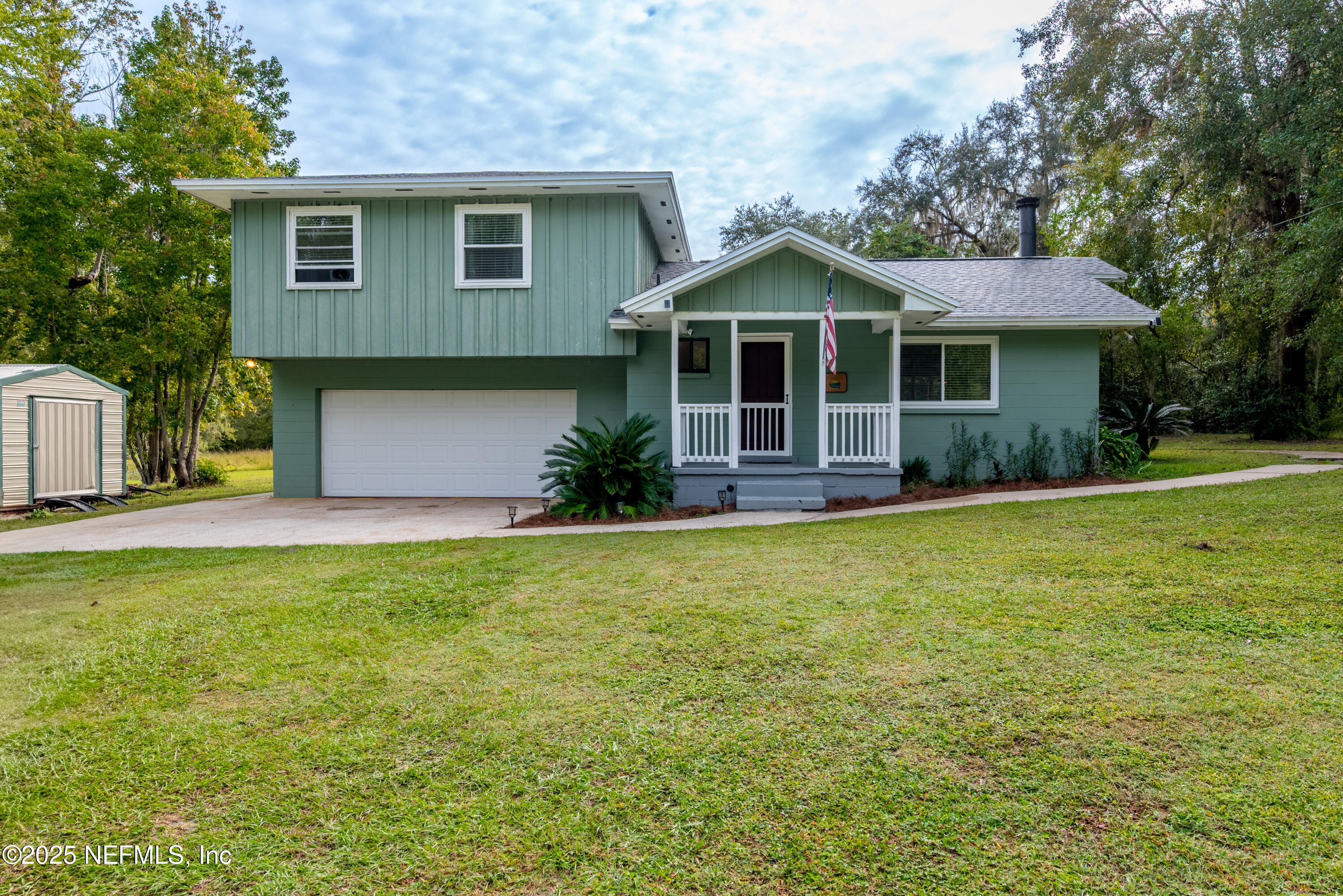 18311 Northeast 21 Street Gainesville, FL 32609 - Photo 3 of 80 a front view of a house with a yard