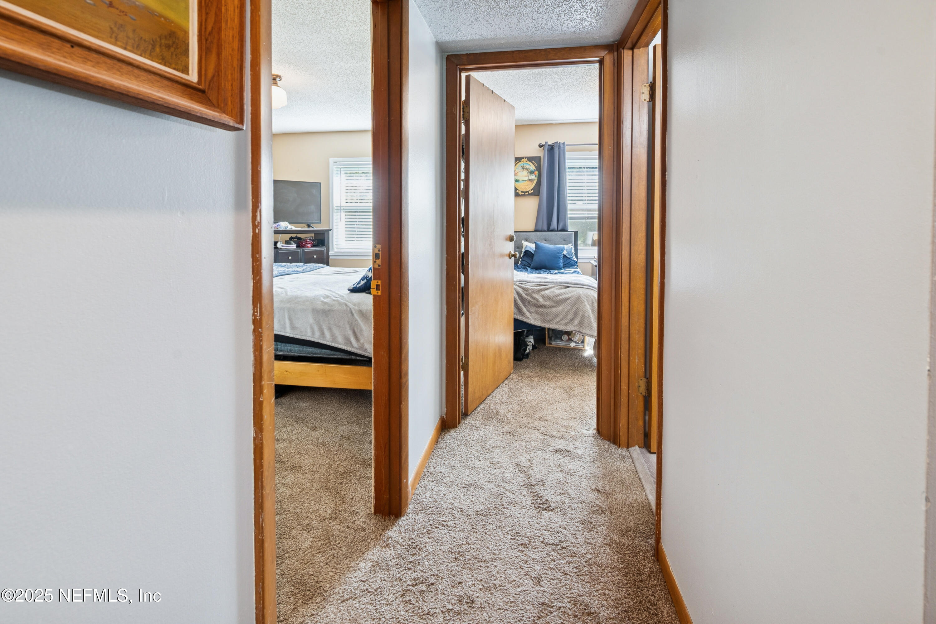 18311 Northeast 21 Street Gainesville, FL 32609 - Photo 44 of 80 a view of a bedroom from a hallway