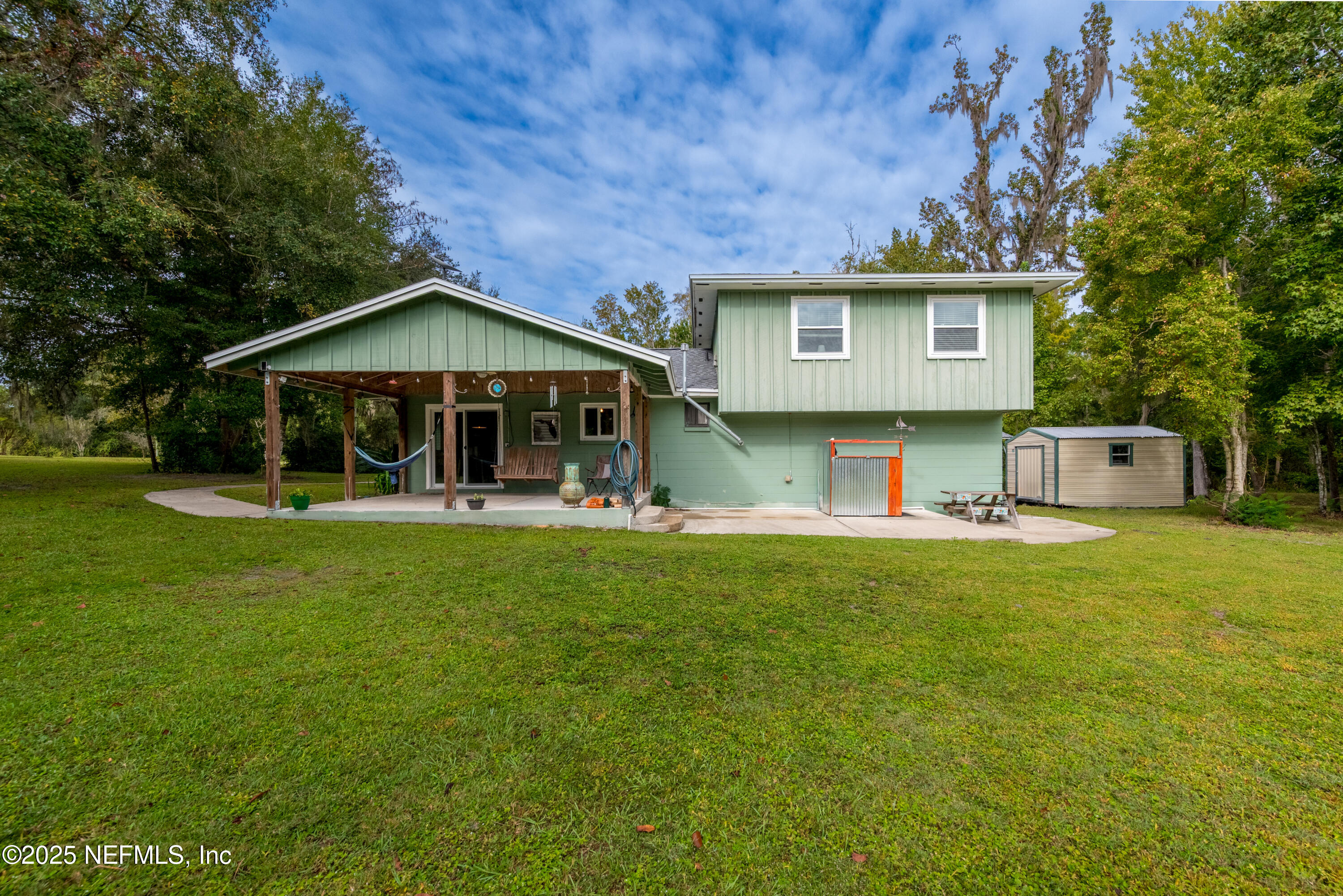 18311 Northeast 21 Street Gainesville, FL 32609 - Photo 48 of 80 a front view of a house with a yard