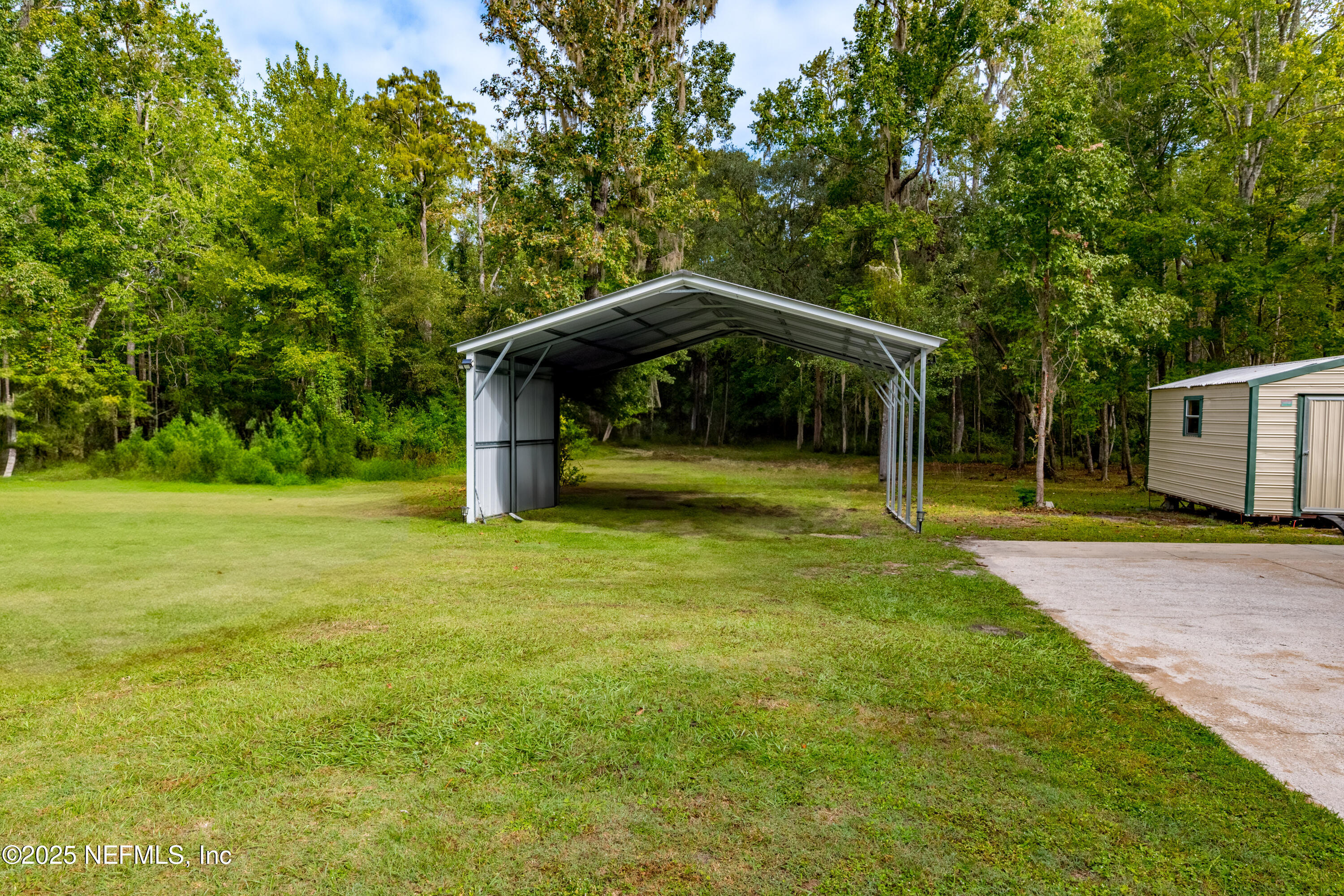18311 Northeast 21 Street Gainesville, FL 32609 - Photo 61 of 80 a view of a garden with a slide