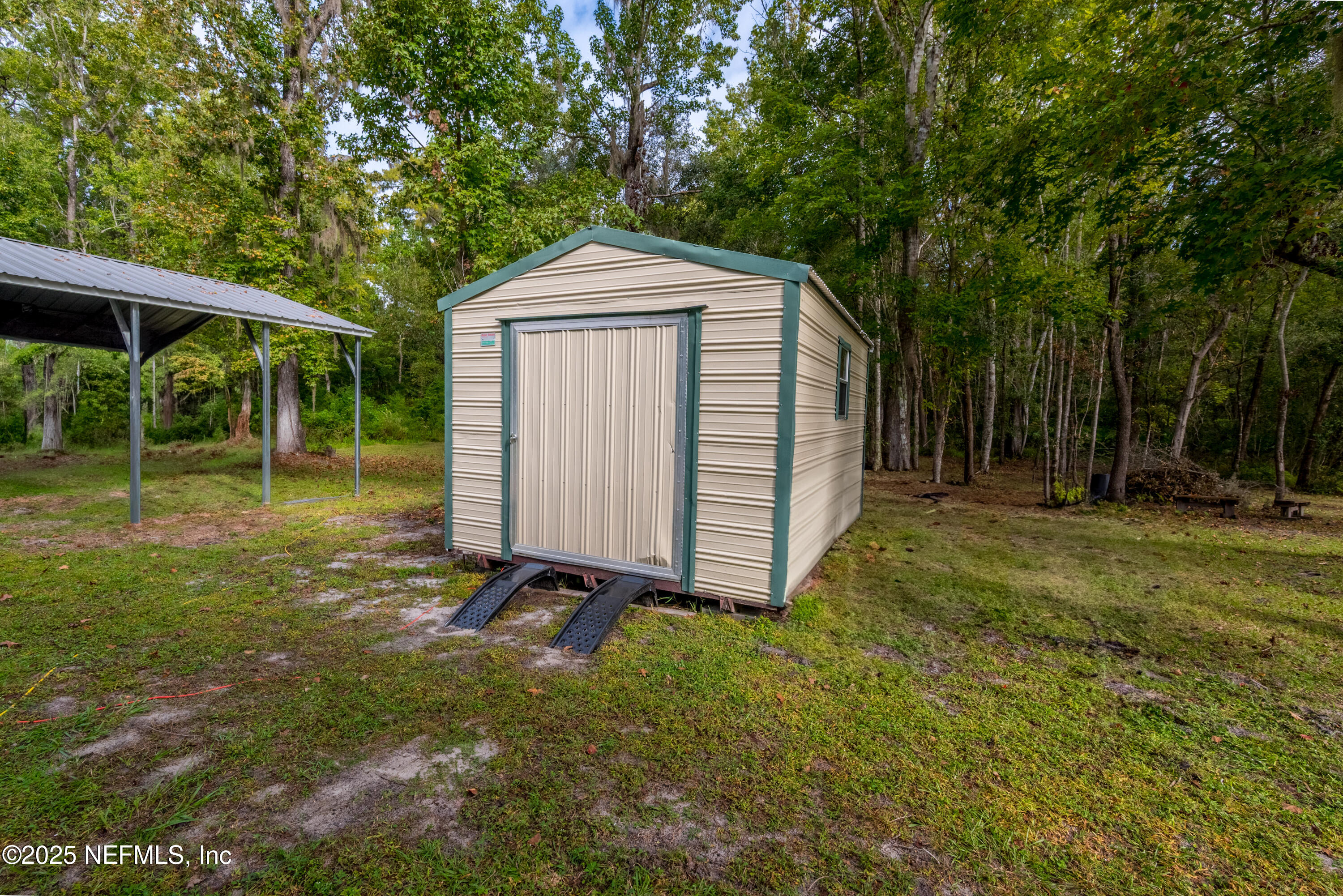 18311 Northeast 21 Street Gainesville, FL 32609 - Photo 62 of 80 a front view of a house with garden