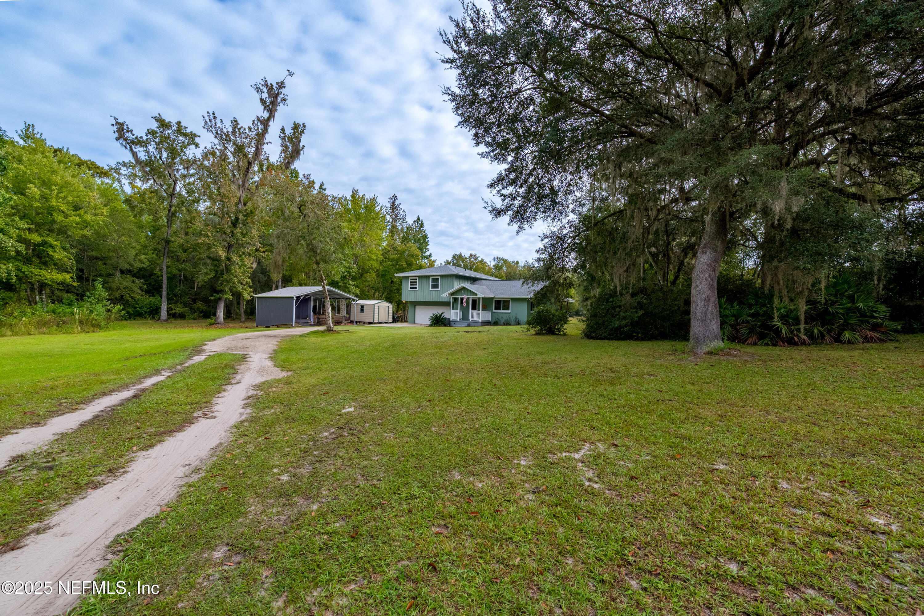 18311 Northeast 21 Street Gainesville, FL 32609 - Photo 65 of 80 a view of a house with a yard