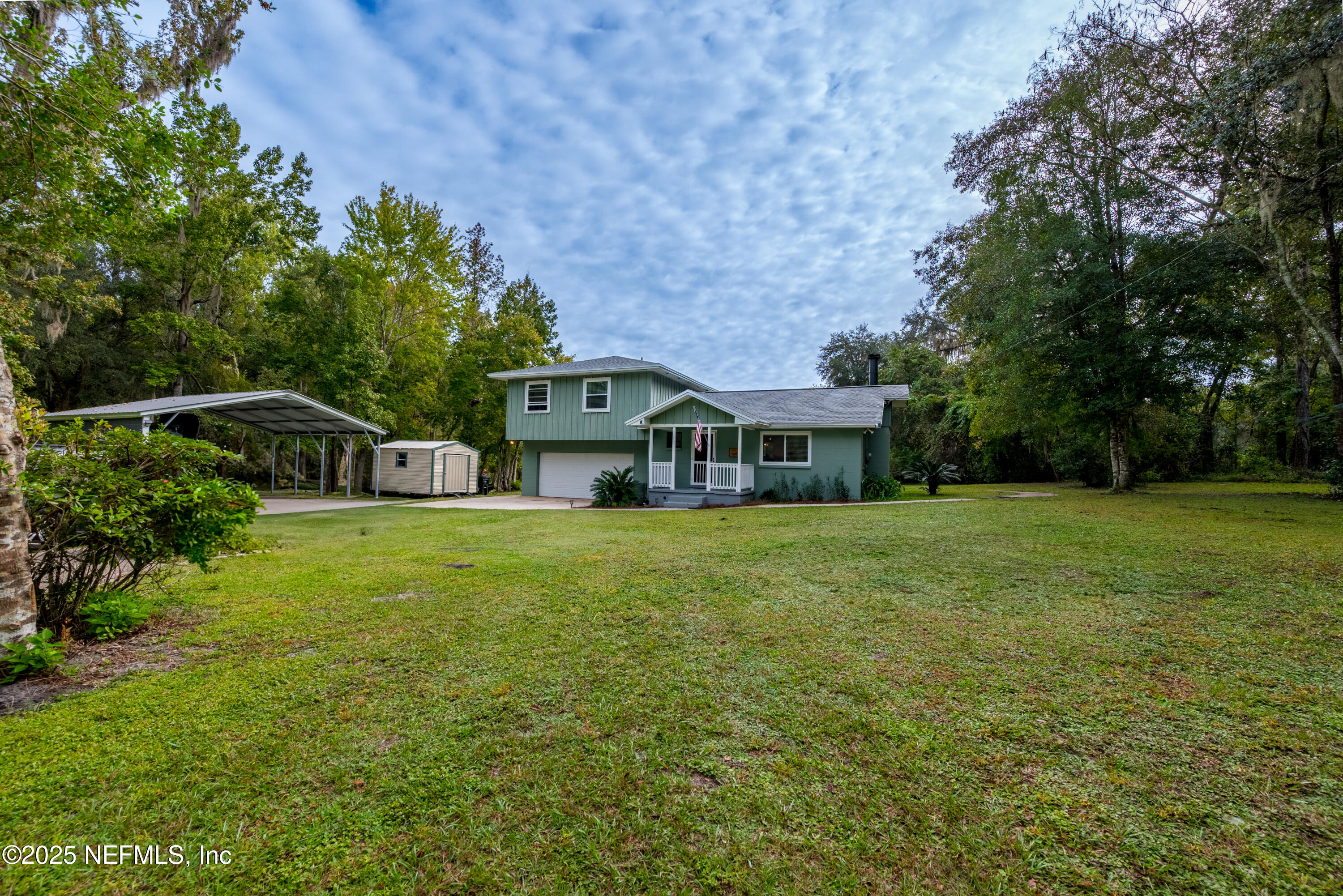 18311 Northeast 21 Street Gainesville, FL 32609 - Photo 67 of 80 a front view of a house with a garden