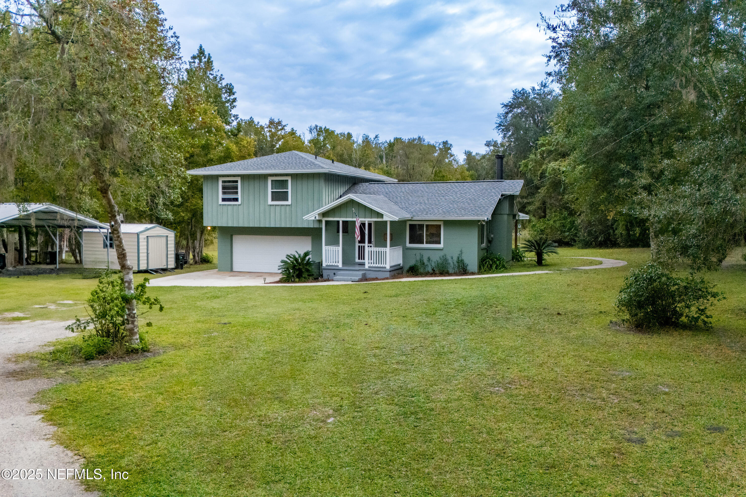 18311 Northeast 21 Street Gainesville, FL 32609 - Photo 69 of 80 a front view of a house with a yard