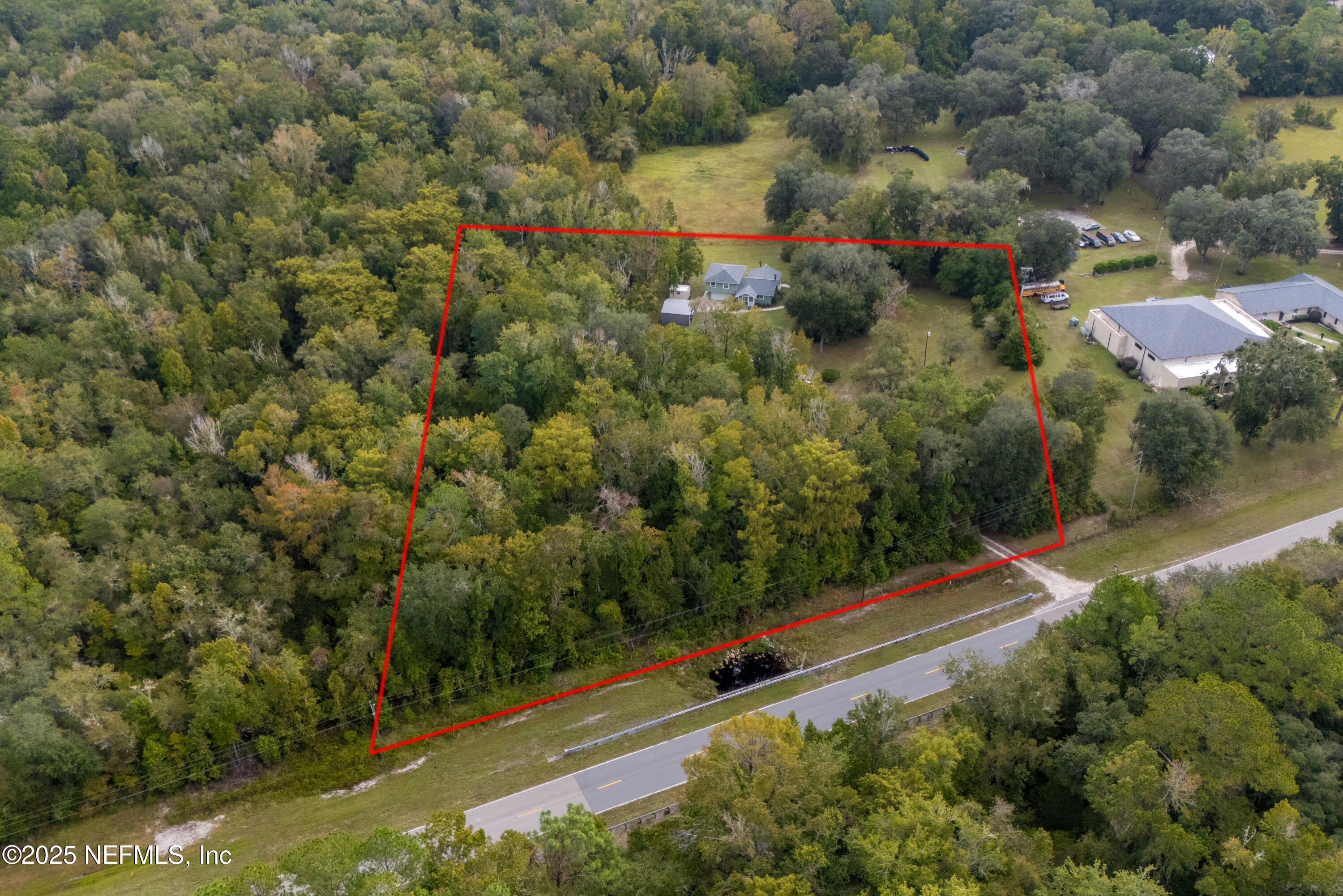 18311 Northeast 21 Street Gainesville, FL 32609 - Photo 71 of 80 an aerial view of residential house with outdoor space and trees all around