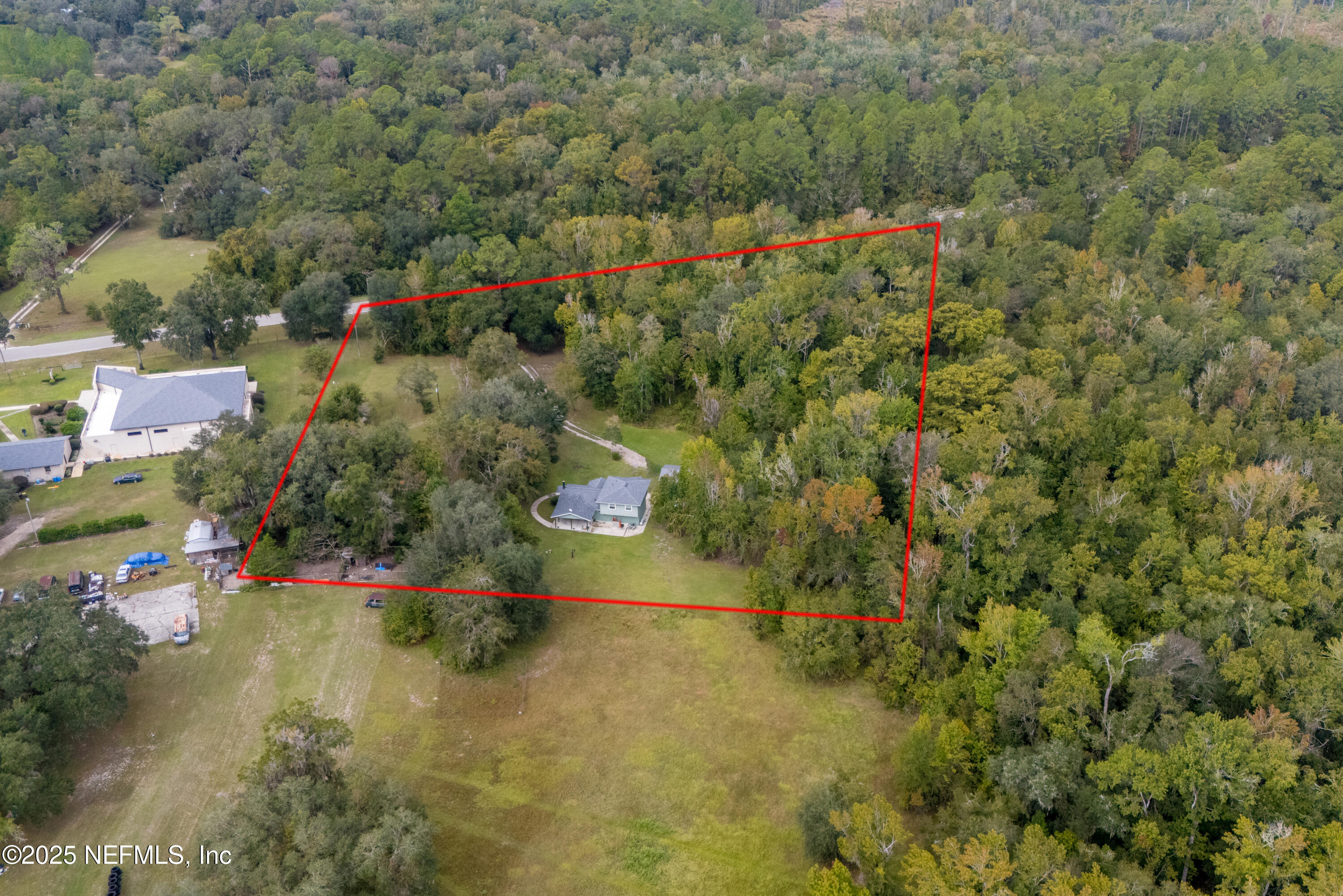 18311 Northeast 21 Street Gainesville, FL 32609 - Photo 79 of 80 an aerial view of residential houses with outdoor space and trees