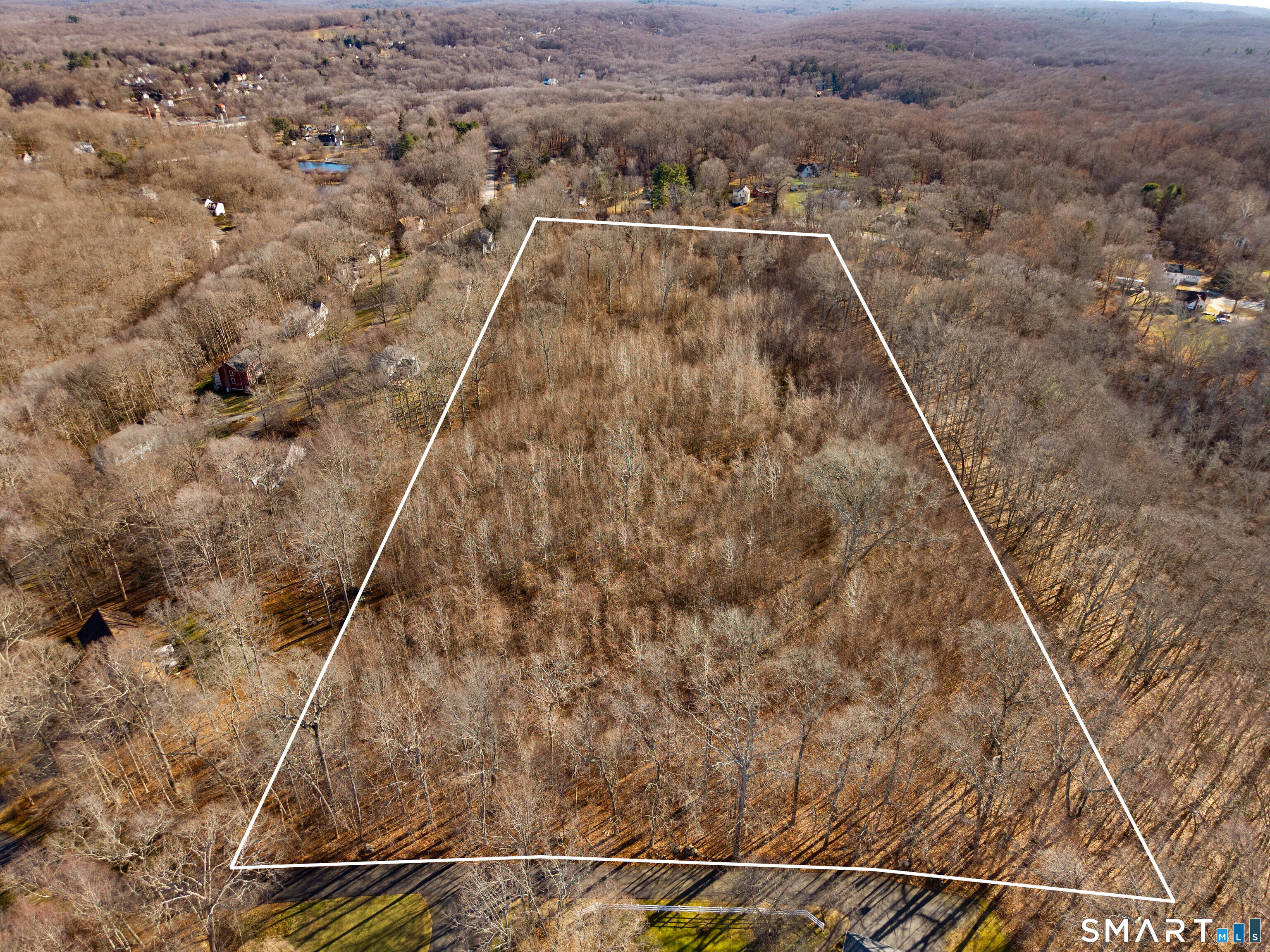 41 Bushy Hill Road Essex, CT 06442 - Photo 2 of 36 a view of a dry yard with wooden fence