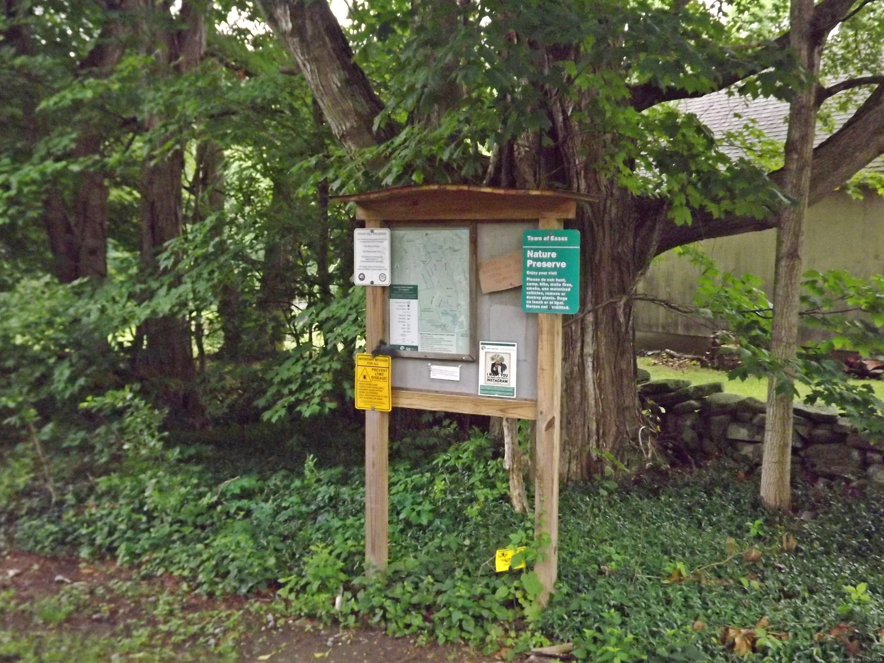 41 Bushy Hill Road Essex, CT 06442 - Photo 34 of 38 a sign that is on the side of a road