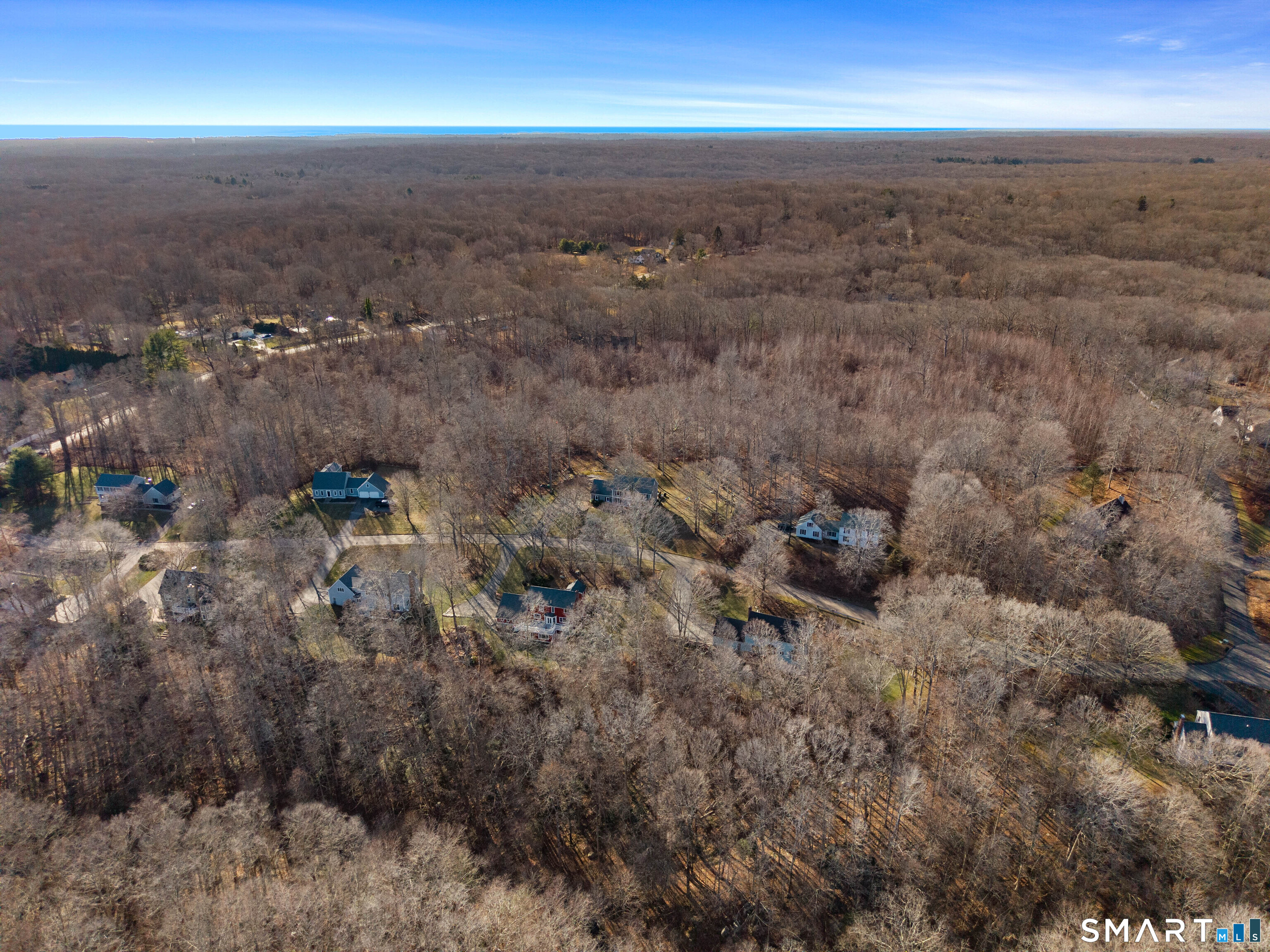 41 Bushy Hill Road Essex, CT 06442 - Photo 4 of 38 an aerial view of beach and residential building in background