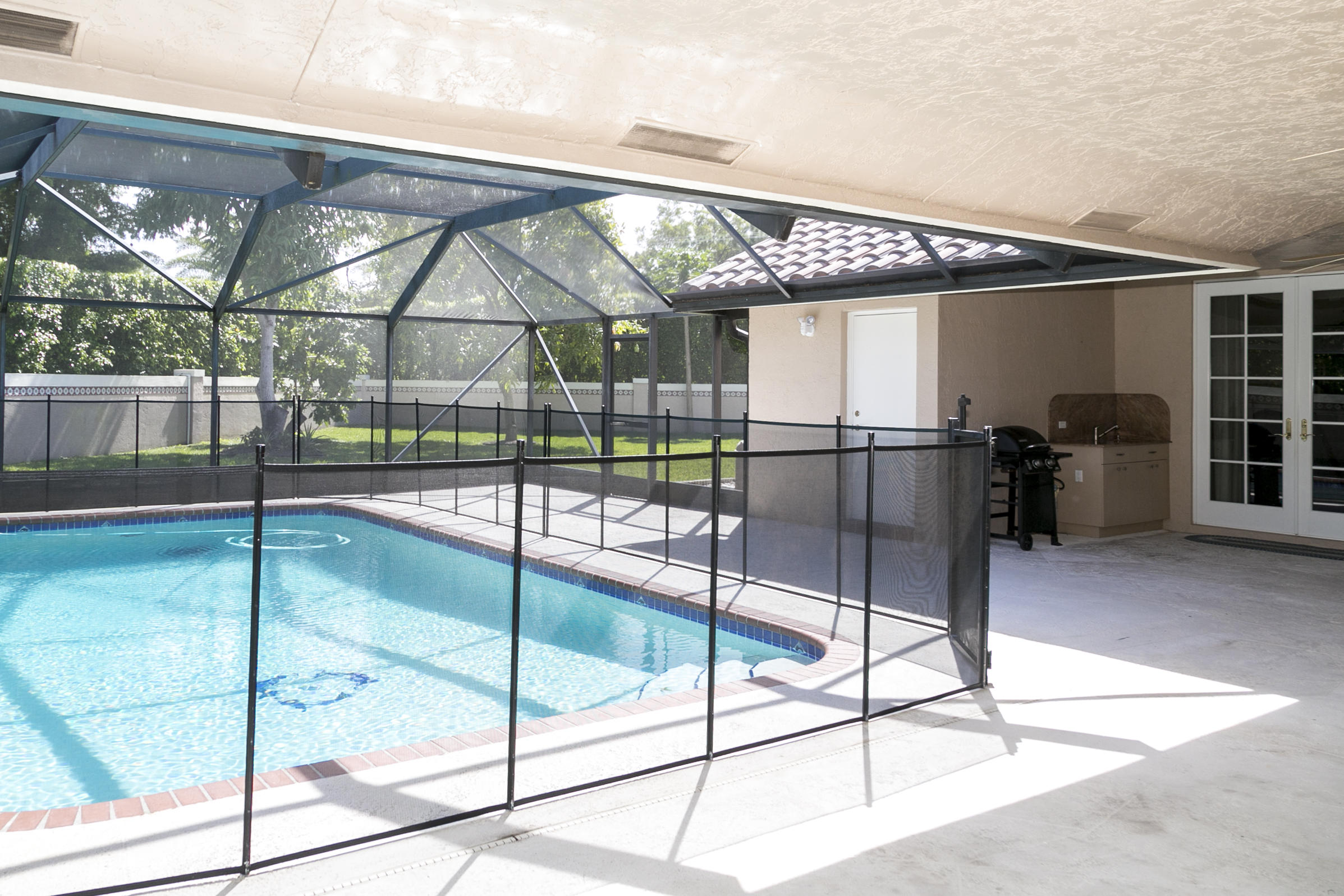 2501 Northwest 29th Drive Boca Raton, FL 33434 - Photo 7 of 39 Pool/Patio/BBQ Area/French Doors