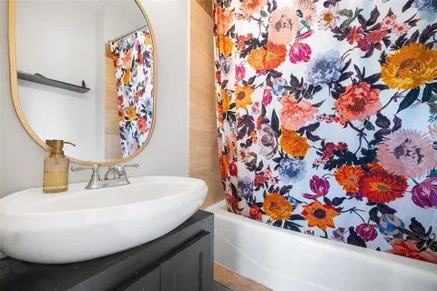 a bathroom with a sink and a mirror
