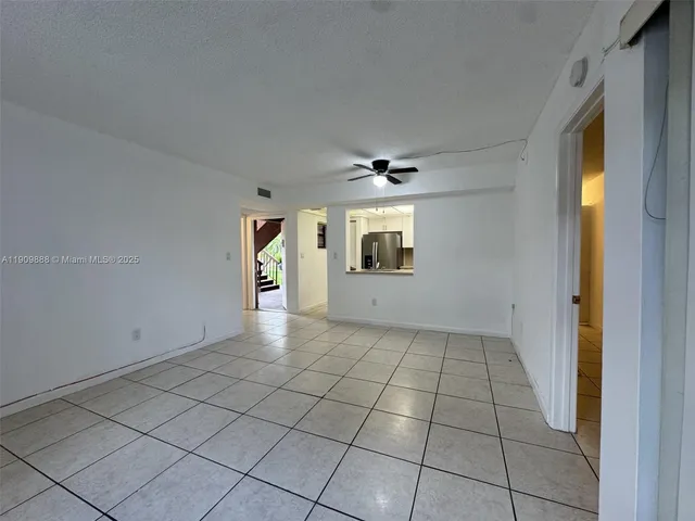 a view of an empty room and window
