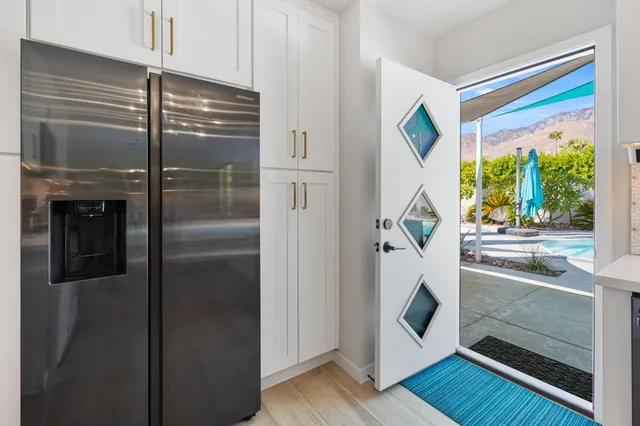 a kitchen with a sink a counter and a window