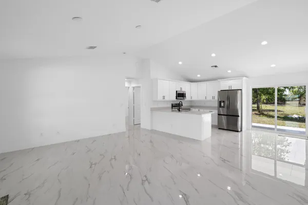 a view of kitchen with wooden floor