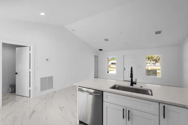 a view of a sink and a window