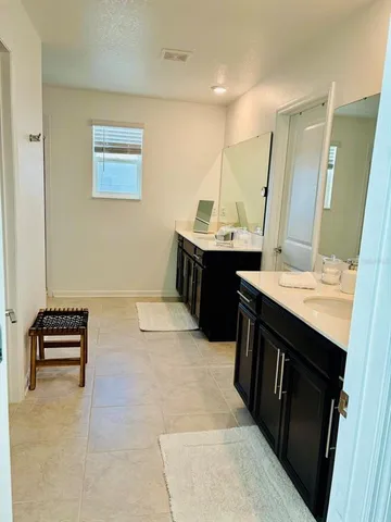 a kitchen with a sink and a stove top oven