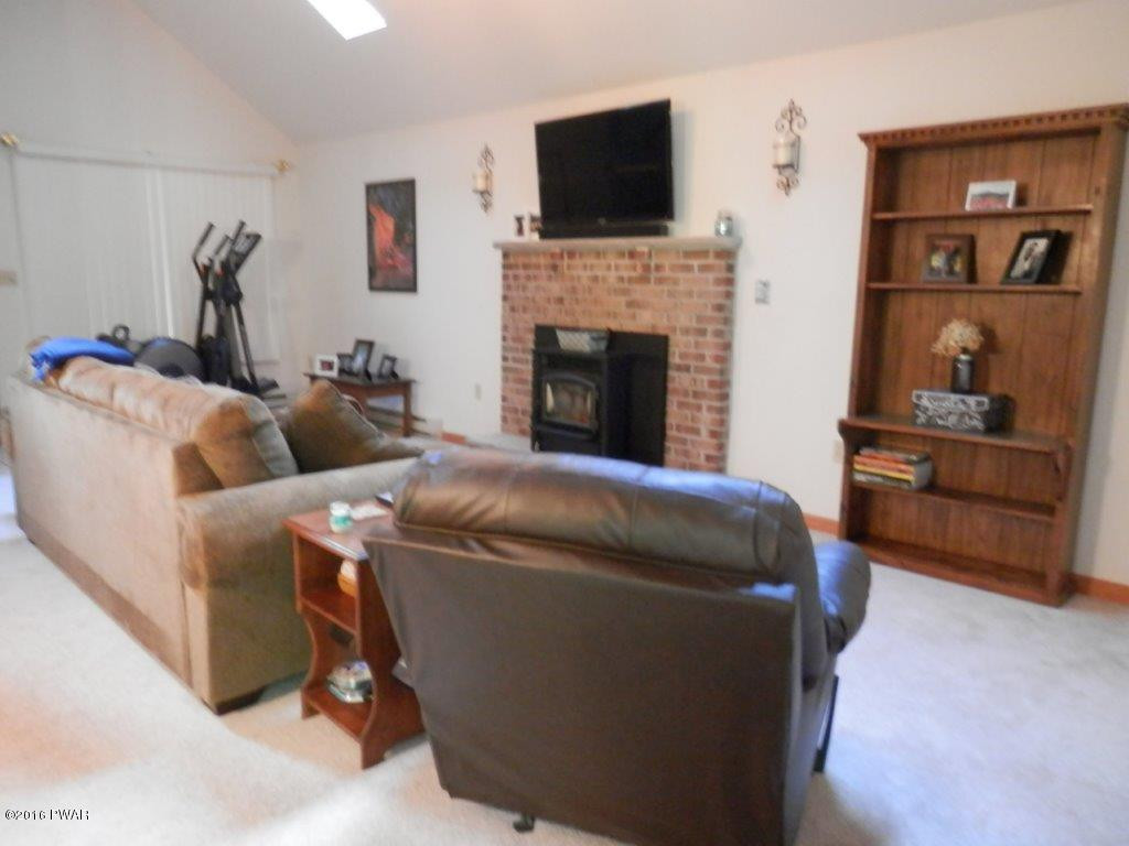 621 Silver Lake Road Dingmans Ferry, PA 18328 - Photo 3 of 14 a living room with furniture and a flat screen tv