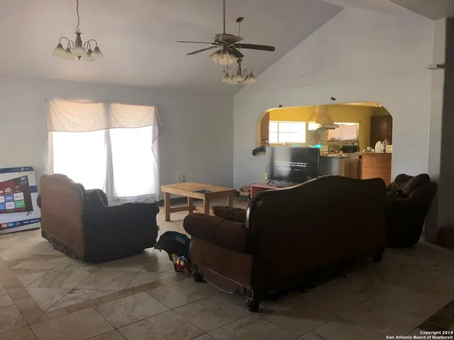 a living room with furniture and a window