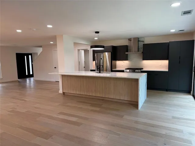 a view of kitchen with granite countertop counter top space and stainless steel appliances