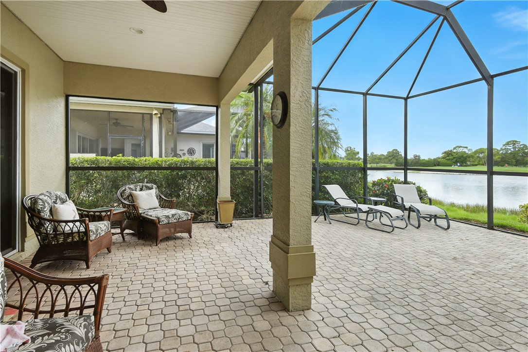 620 Bridgewater Lane Southwest Vero Beach, FL 32962 - Photo 12 of 31 a view of a patio with a table chairs and a patio
