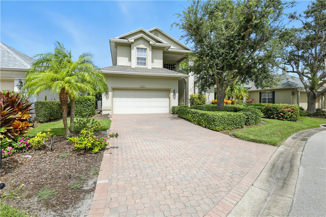 620 Bridgewater Lane Southwest Vero Beach, FL 32962 - Photo 26 of 31 a front view of a house with a yard and garage