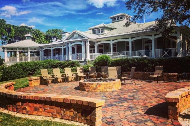 620 Bridgewater Lane Southwest Vero Beach, FL 32962 - Photo 29 of 31 a view of a house with swimming pool and sitting area