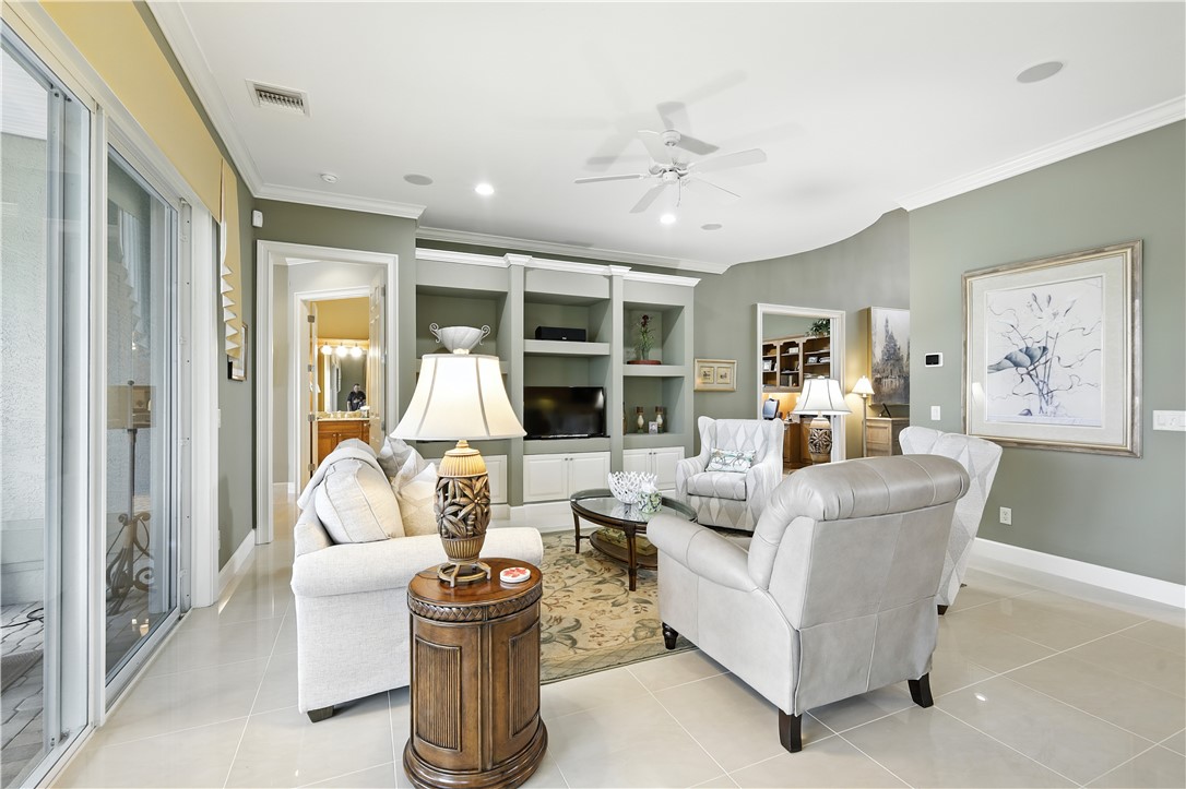 620 Bridgewater Lane Southwest Vero Beach, FL 32962 - Photo 6 of 31 a living room with furniture and a large window