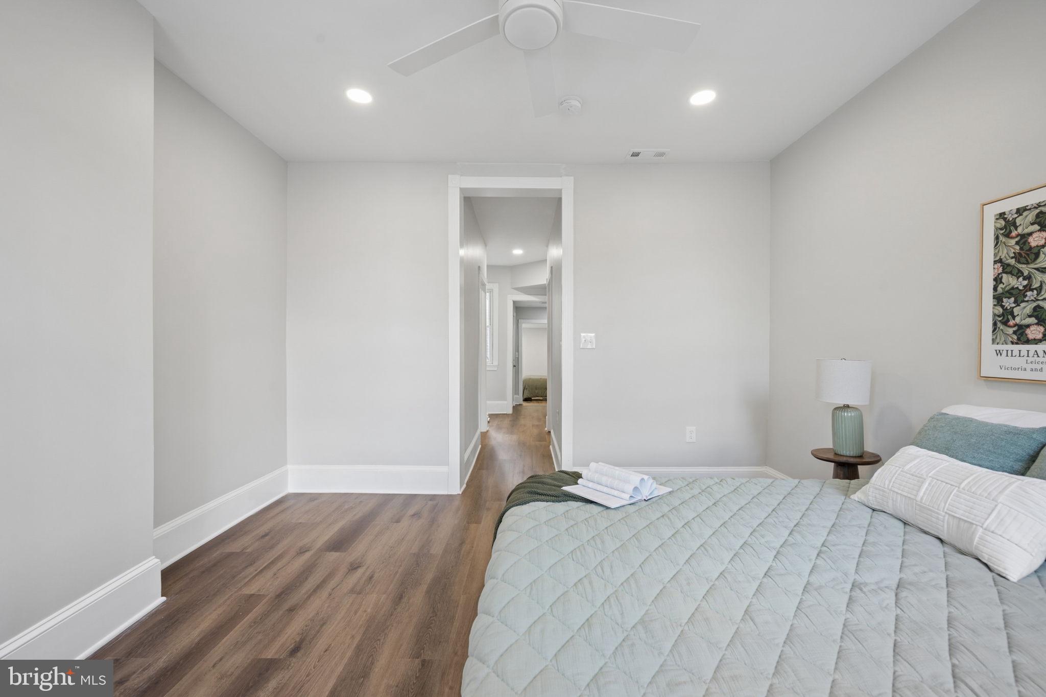 1108 South Clinton Street Baltimore, MD 21224 - Photo 29 of 66 Serene bedroom with modern elegance.