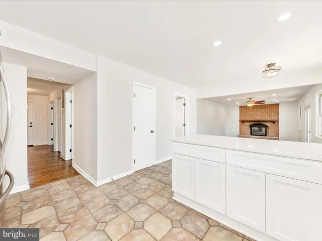 a living room with furniture fireplace and window