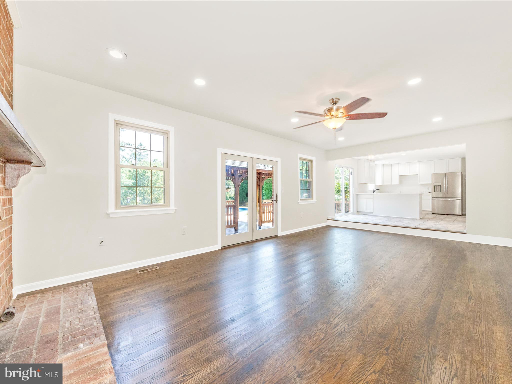 8395 Buckeye Court Frederick, MD 21702 - Photo 18 of 56 a view of an empty room with a window and wooden floor