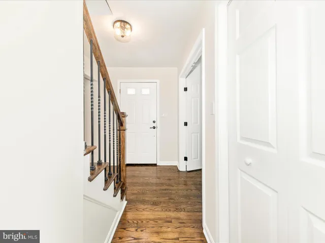 a view of a hallway with paintings on the wall