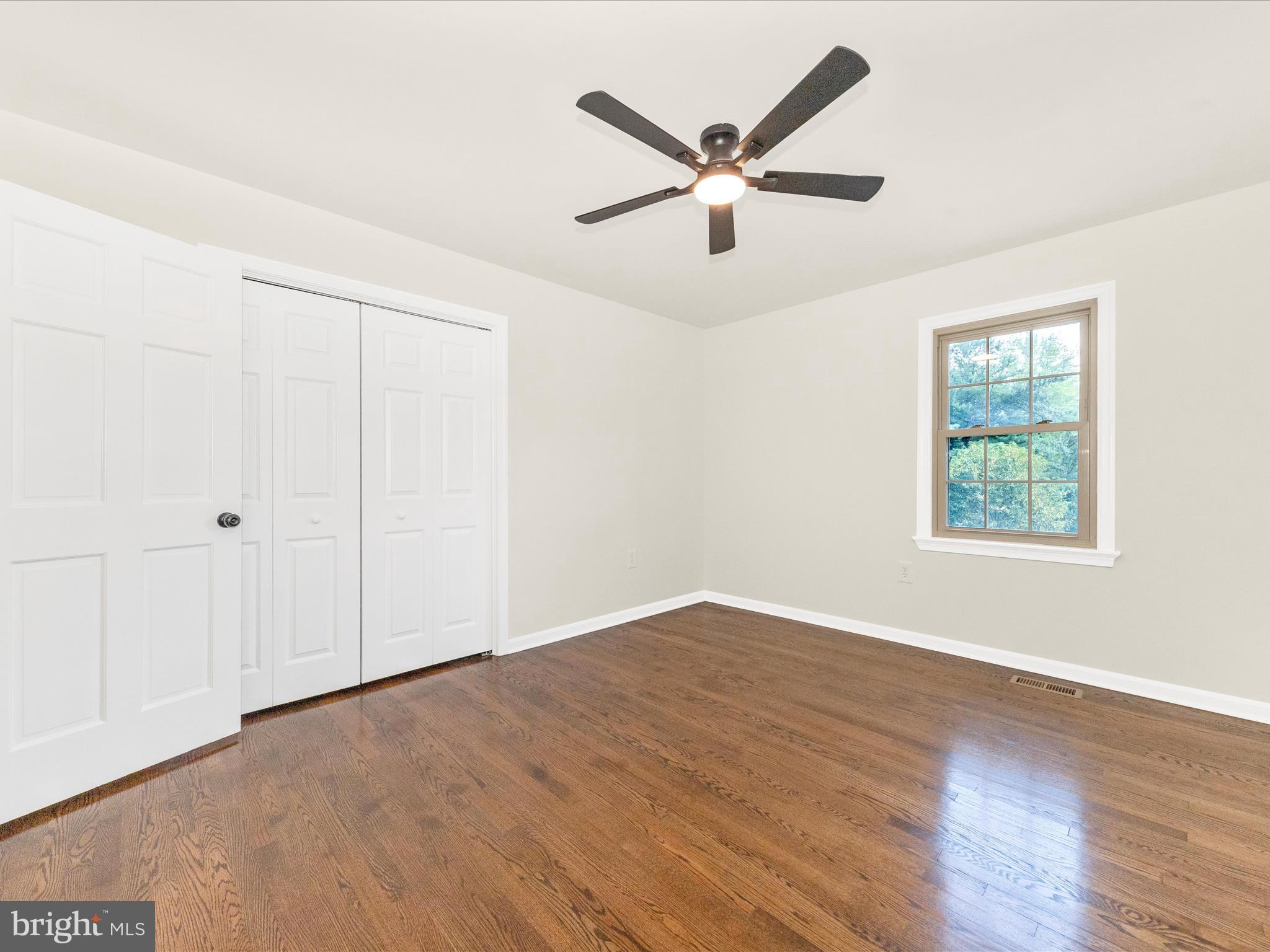 8395 Buckeye Court Frederick, MD 21702 - Photo 27 of 56 wooden floor in an empty room with a window