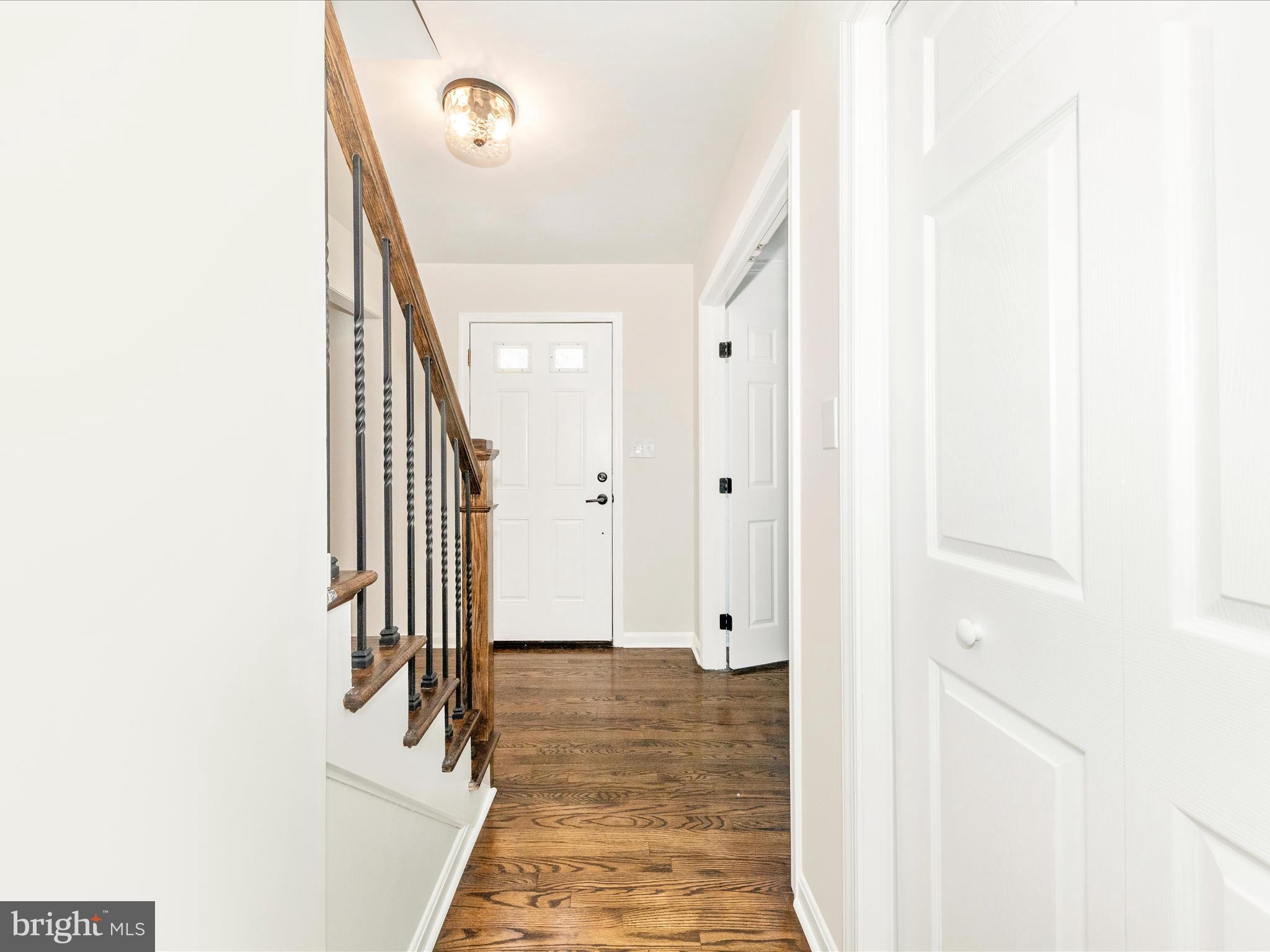 8395 Buckeye Court Frederick, MD 21702 - Photo 3 of 56 a view of a hallway with paintings on the wall