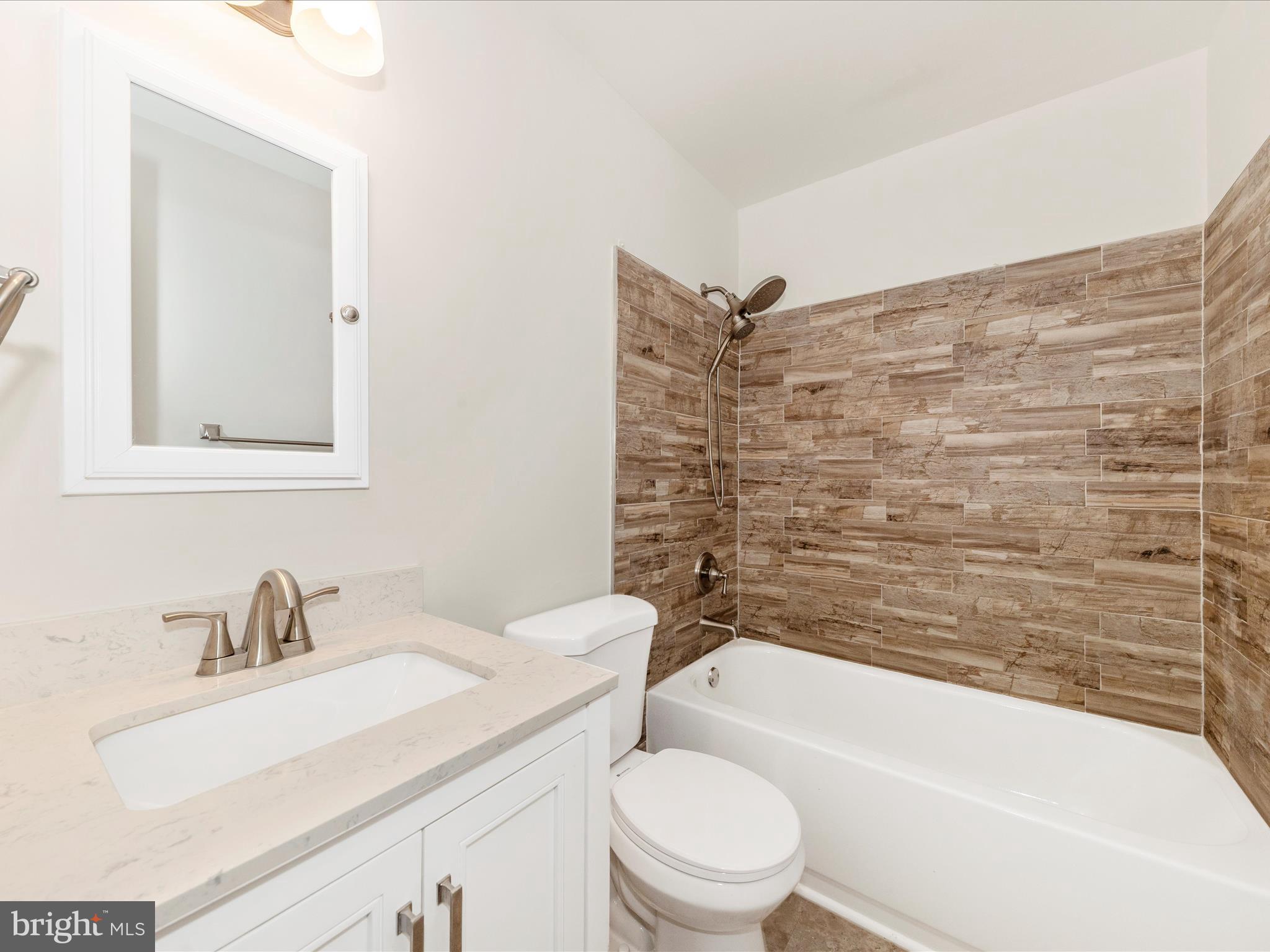 8395 Buckeye Court Frederick, MD 21702 - Photo 32 of 56 a bathroom with a sink toilet and shower