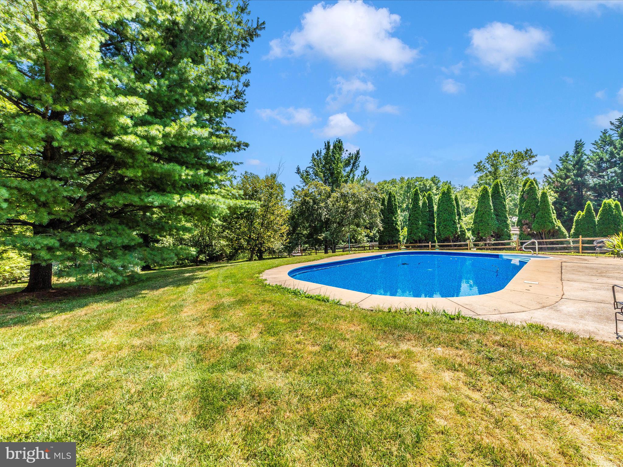 8395 Buckeye Court Frederick, MD 21702 - Photo 49 of 56 a view of a swimming pool with an outdoor space and seating area